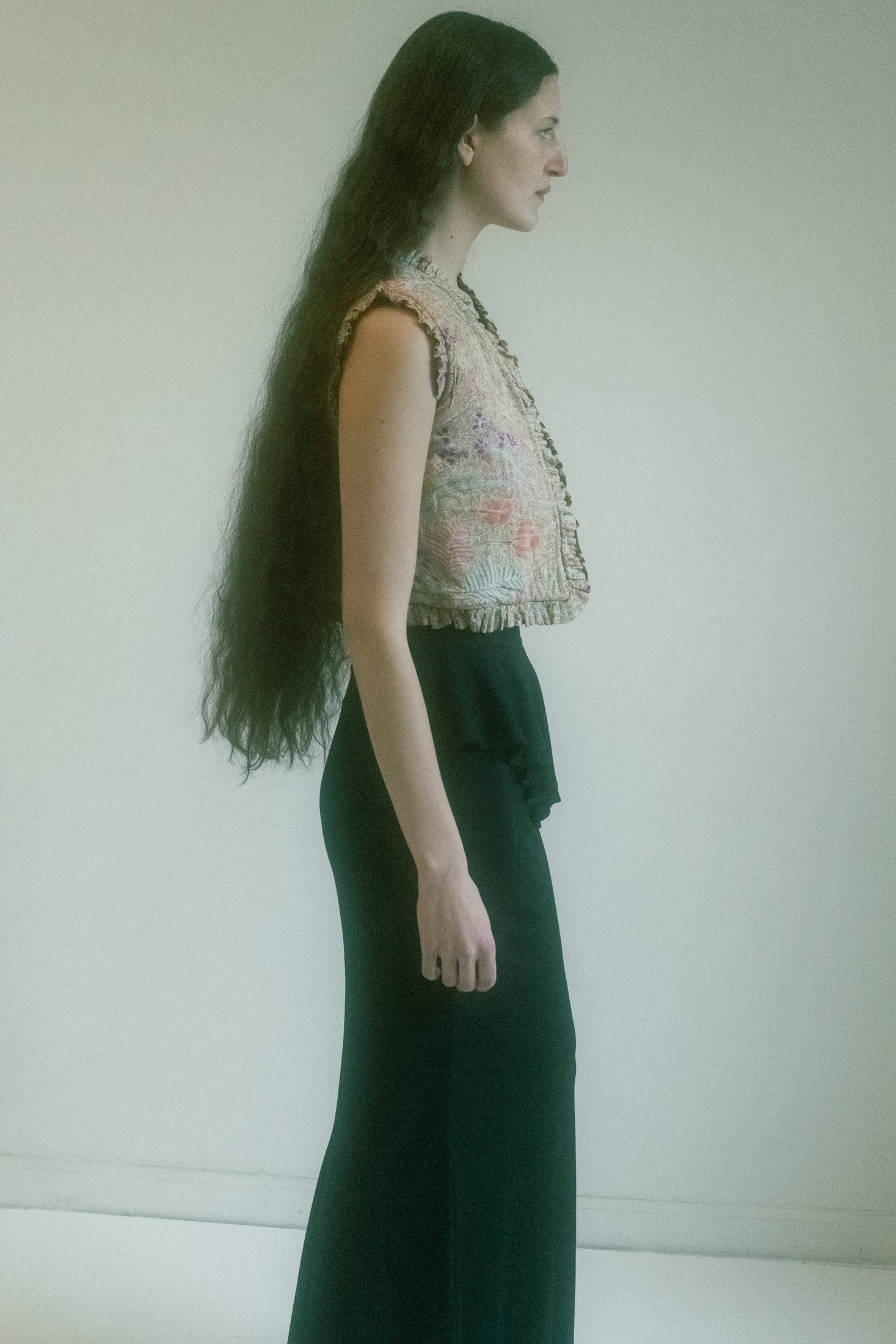 The ruffle detail around the hem flirts with soft femininity.