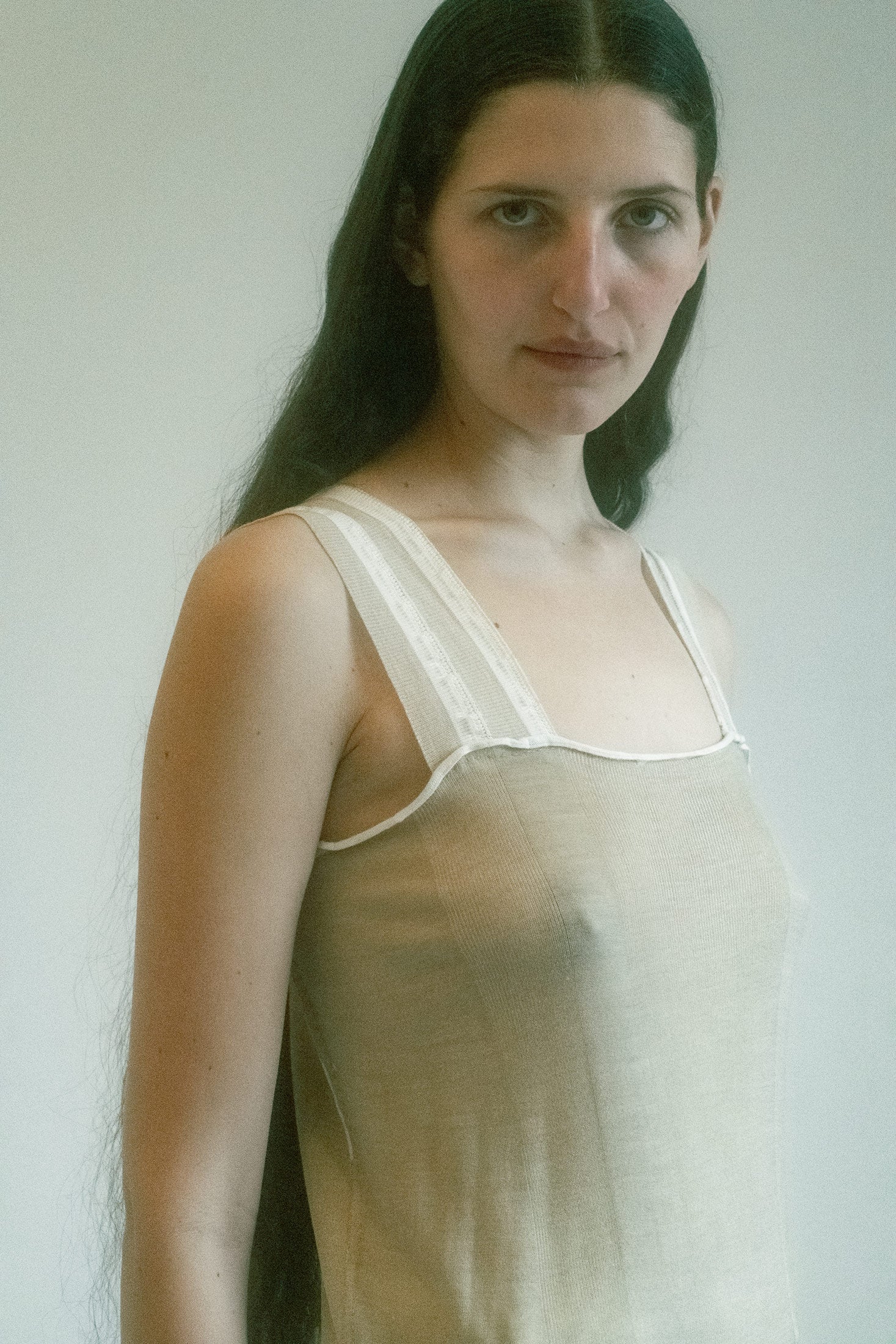 A wink of sport, a trace of seduction—this knit tank by Prada plays the long game.