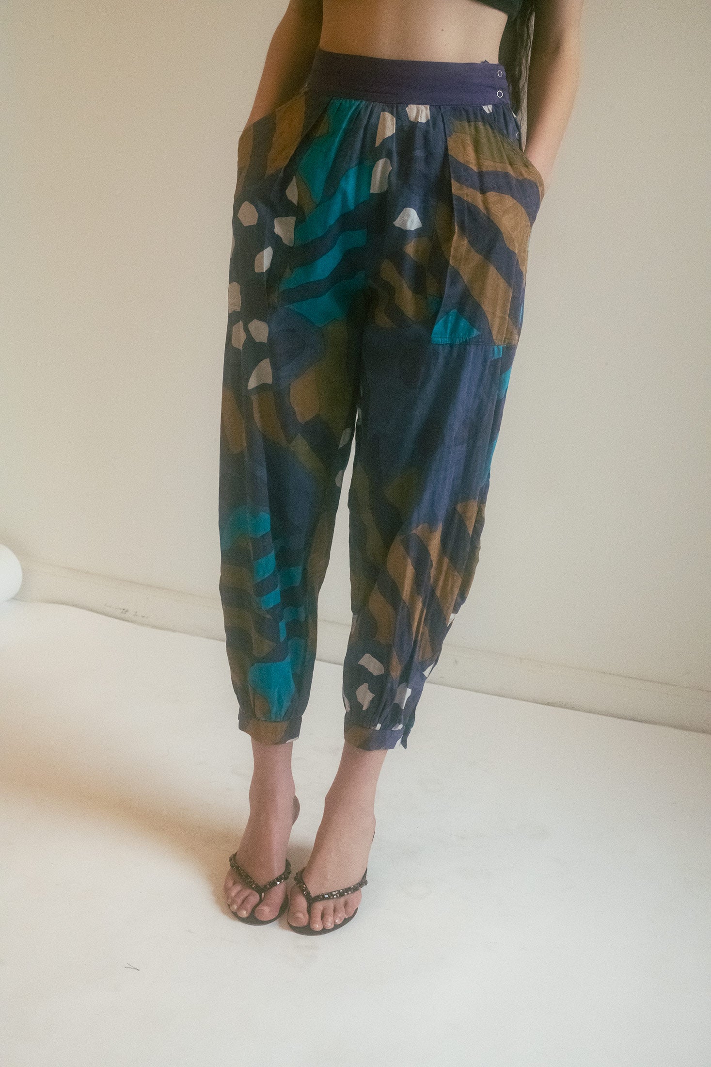 Patterned throughout in an abstract fever dream, these pants move with cinematic fluidity.