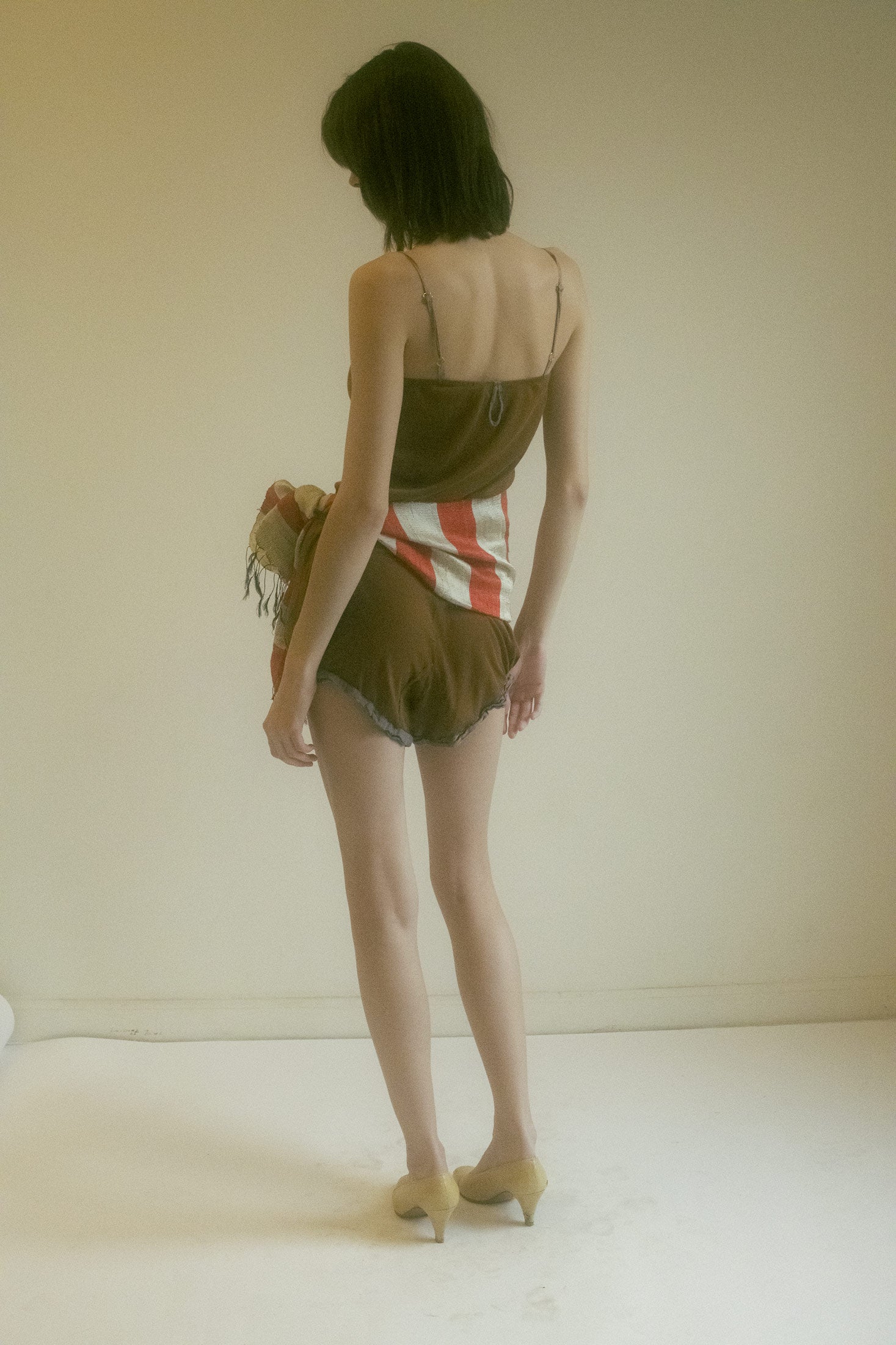 In a rich terracotta hue, it’s the color of sun-kissed skin, warmed by a lingering touch.