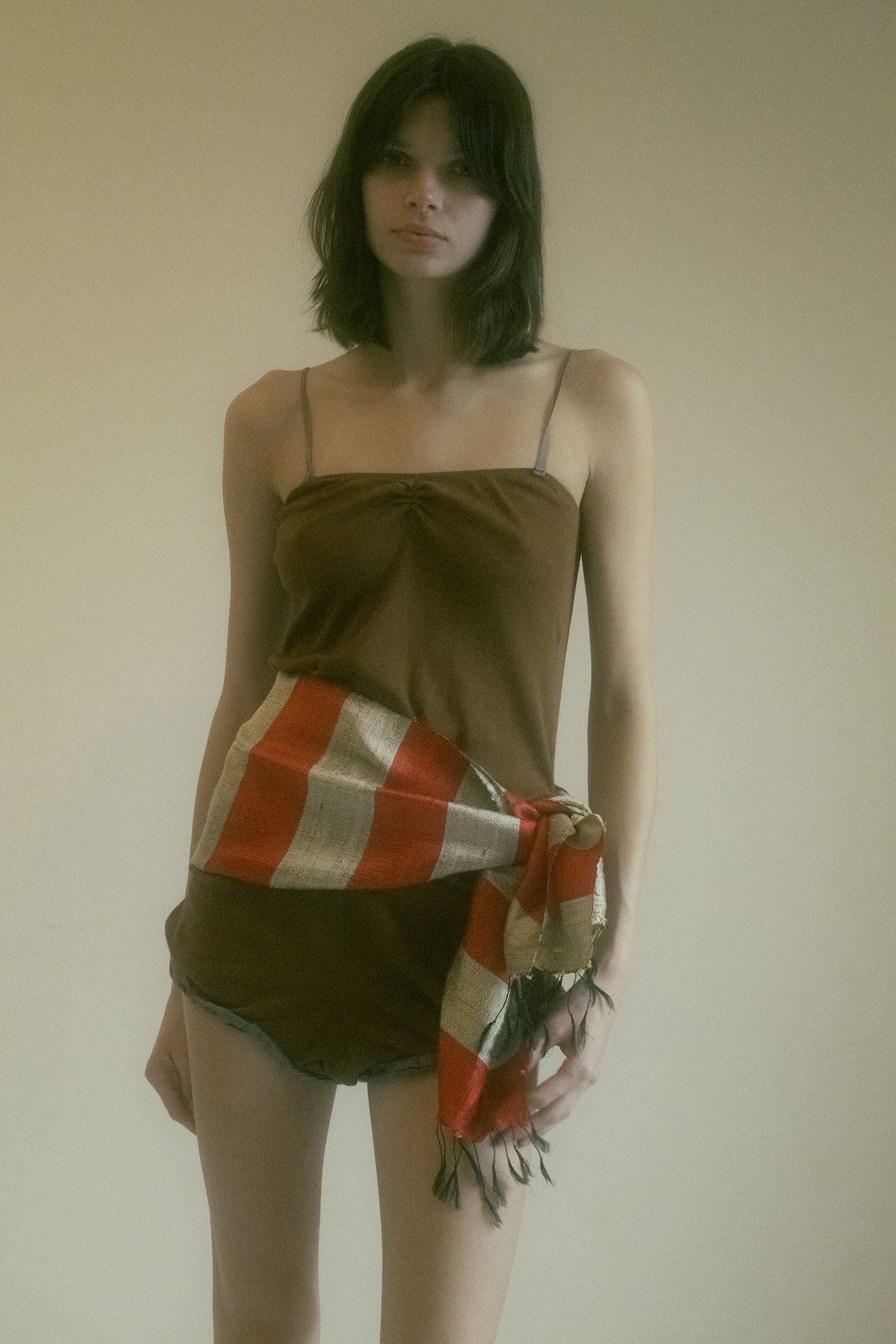 A provocative whisper of flirtation, this cotton cami romper from Araks is a sultry piece that straddles the line between playfulness and allure.