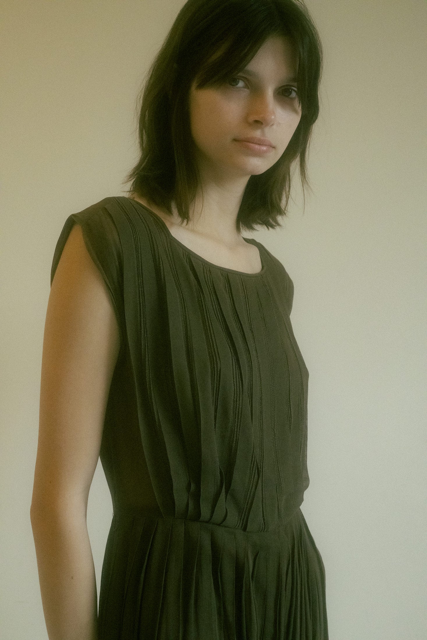 Sleeveless and sculpted with a fitted waistline, this mini dress hugs your figure like the quiet allure of a femme fatale—soft, sensual, yet undeniably bold.