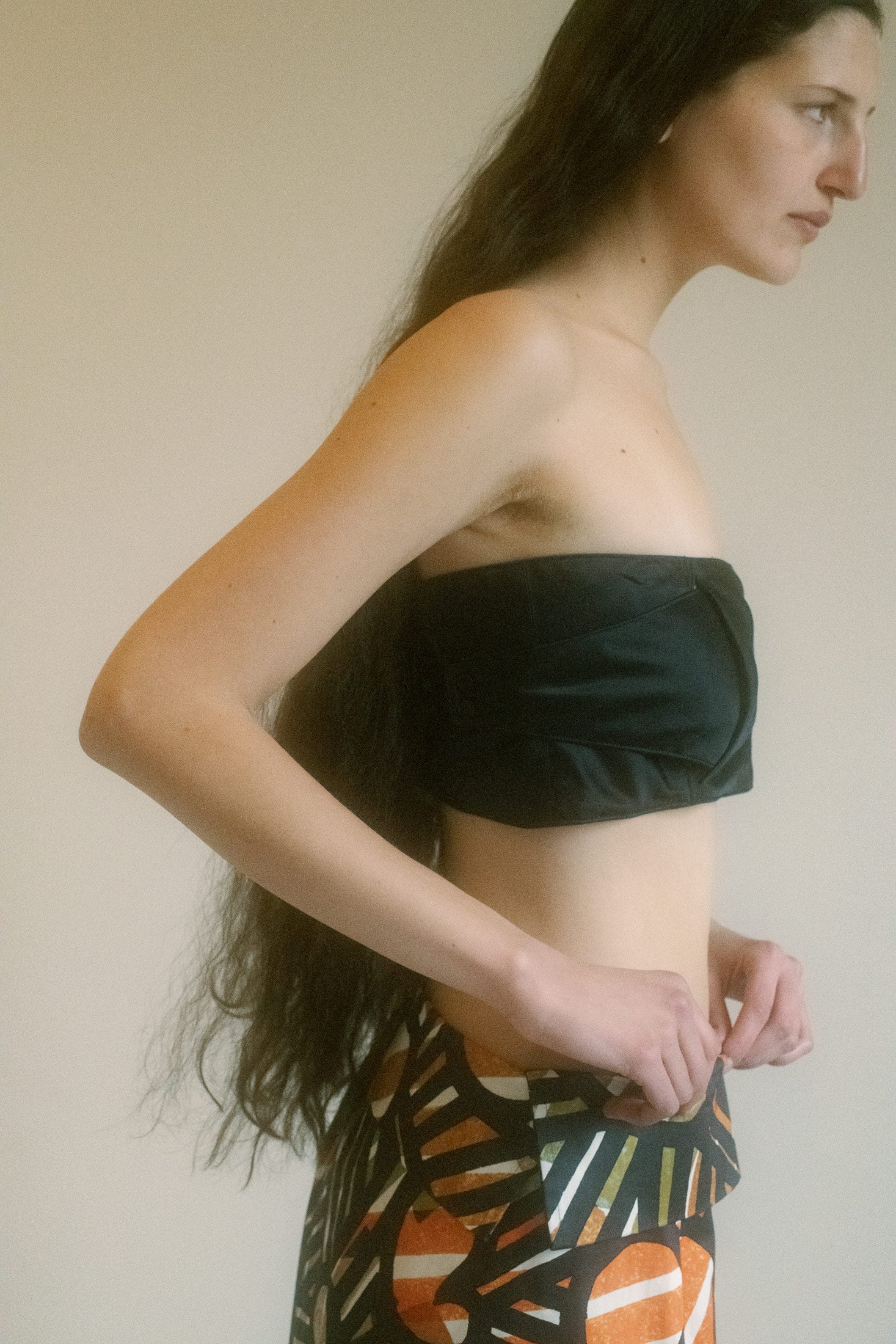 The Christophe Lemaire Tube Top is the epitome of versatile sophistication, offering both style and function in a single, unique piece.