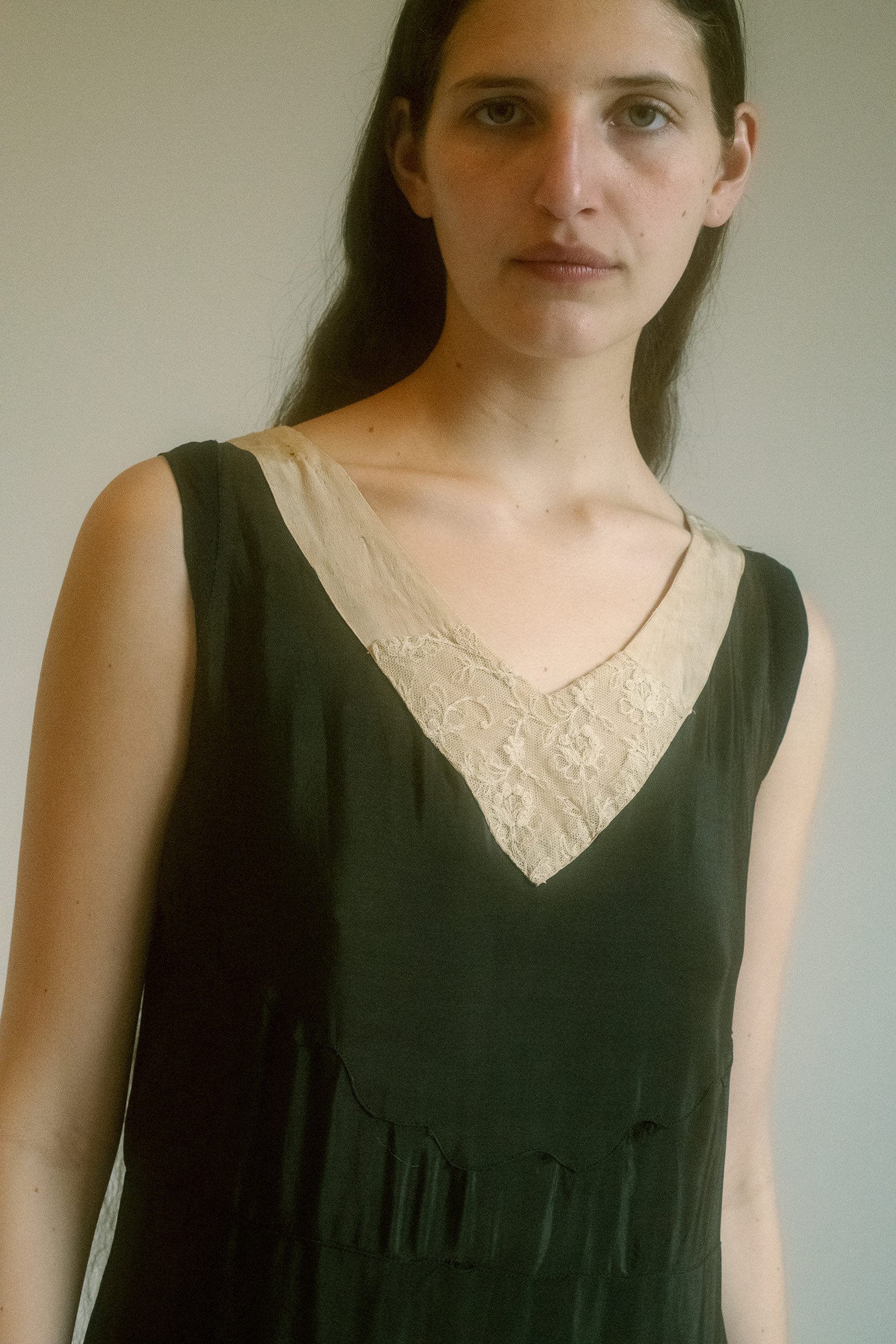 This midi-length, sleeveless dress flows like a dream, lightweight and dynamic—perfect for the woman who moves with purpose and poise.