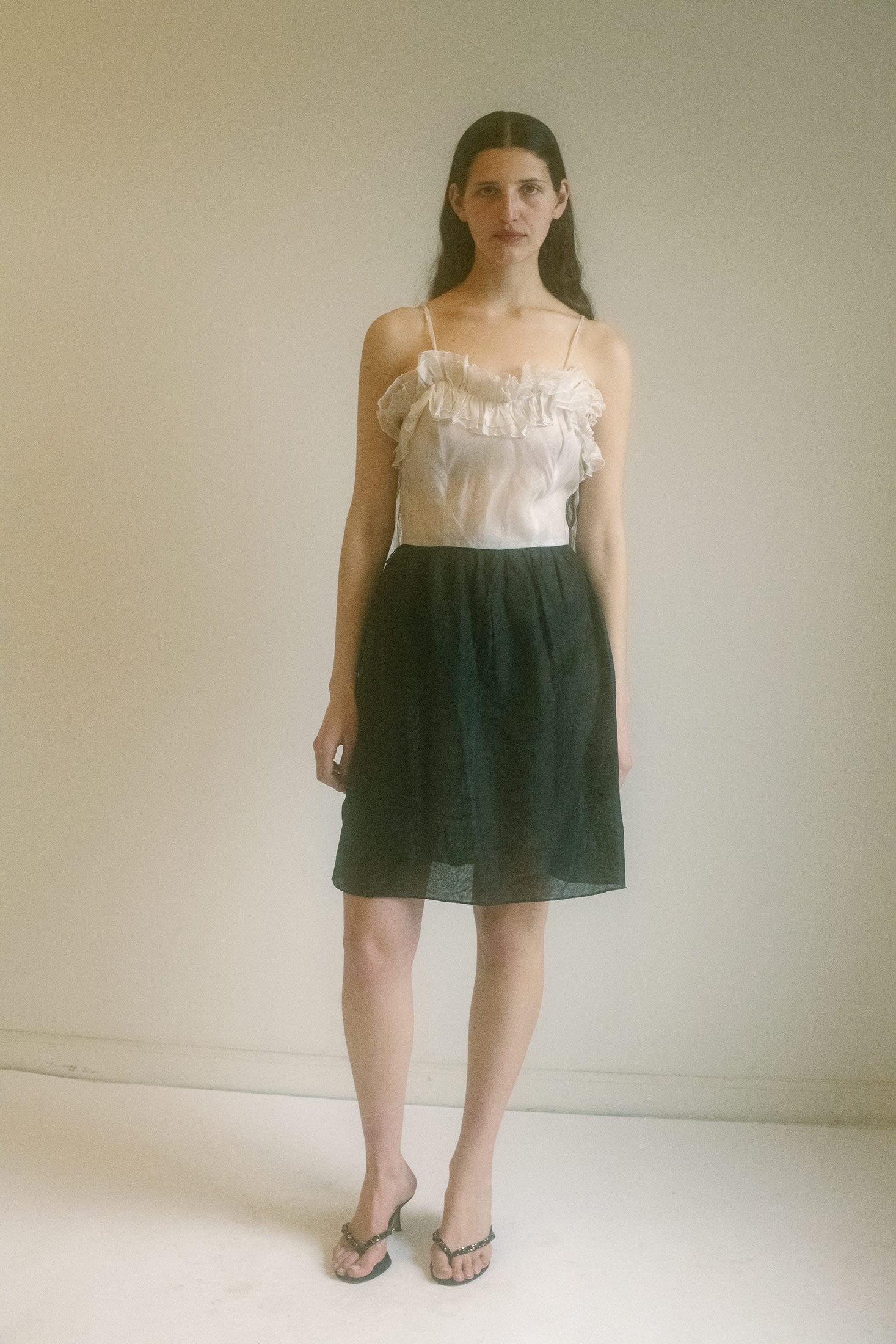 The Vintage Cocktail Dress—a piece that has no business existing in this time, yet feels like it was always meant to be.