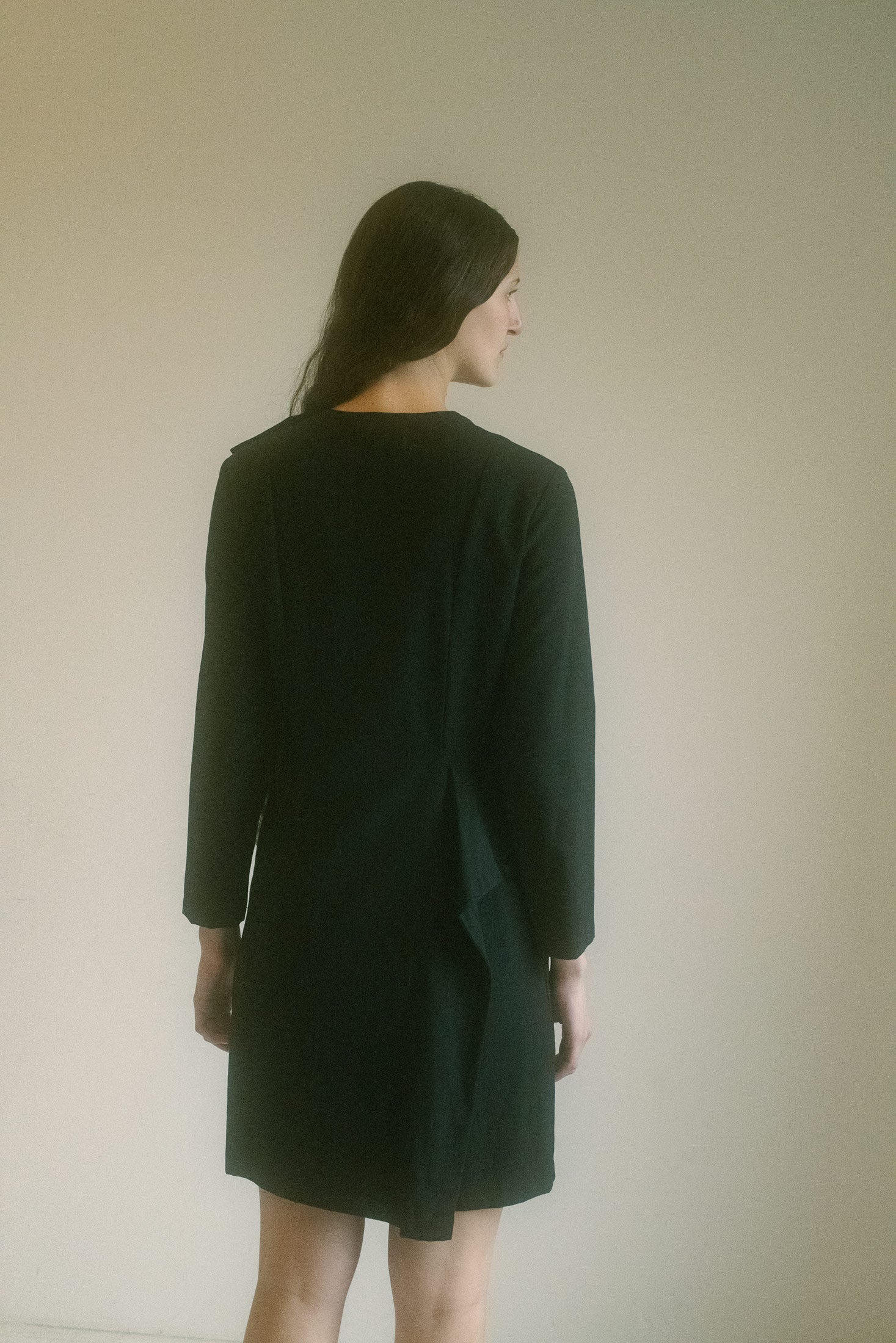 With its long sleeves and simple neckline, this mini dress exudes a timeless chicness that feels effortless yet captivating.