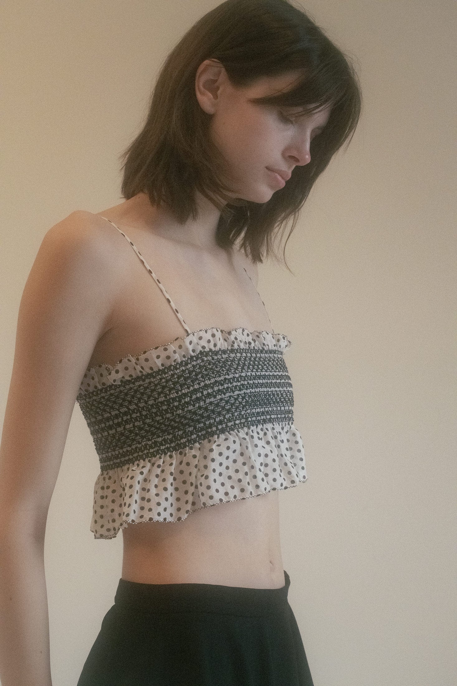 This is not just a top; it's a unique, special piece that exudes understated chic and mysterious allure.