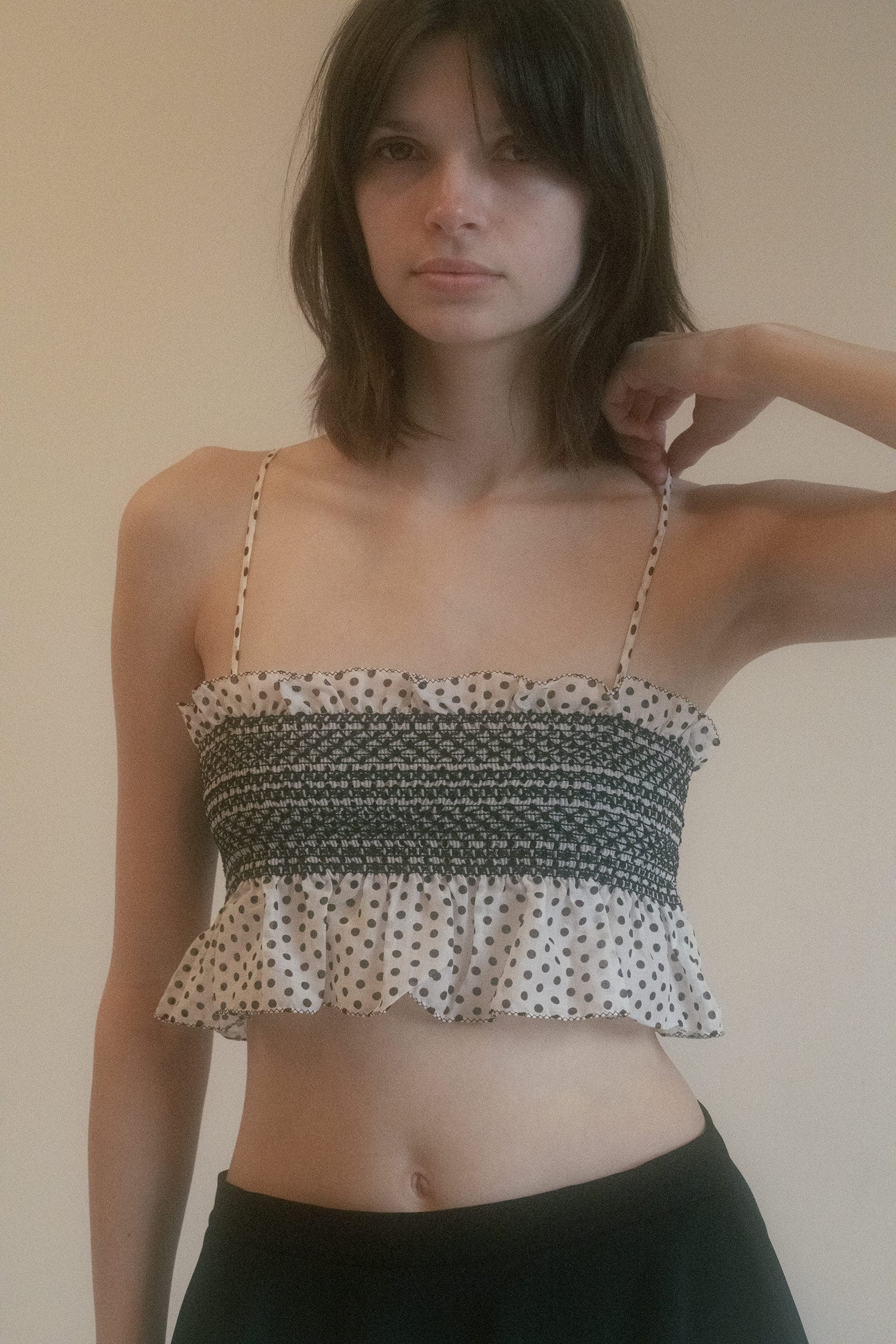 The Lisa Marie Fernandez Crop Top is a playful yet refined piece that effortlessly captures both vintage charm and modern sophistication.