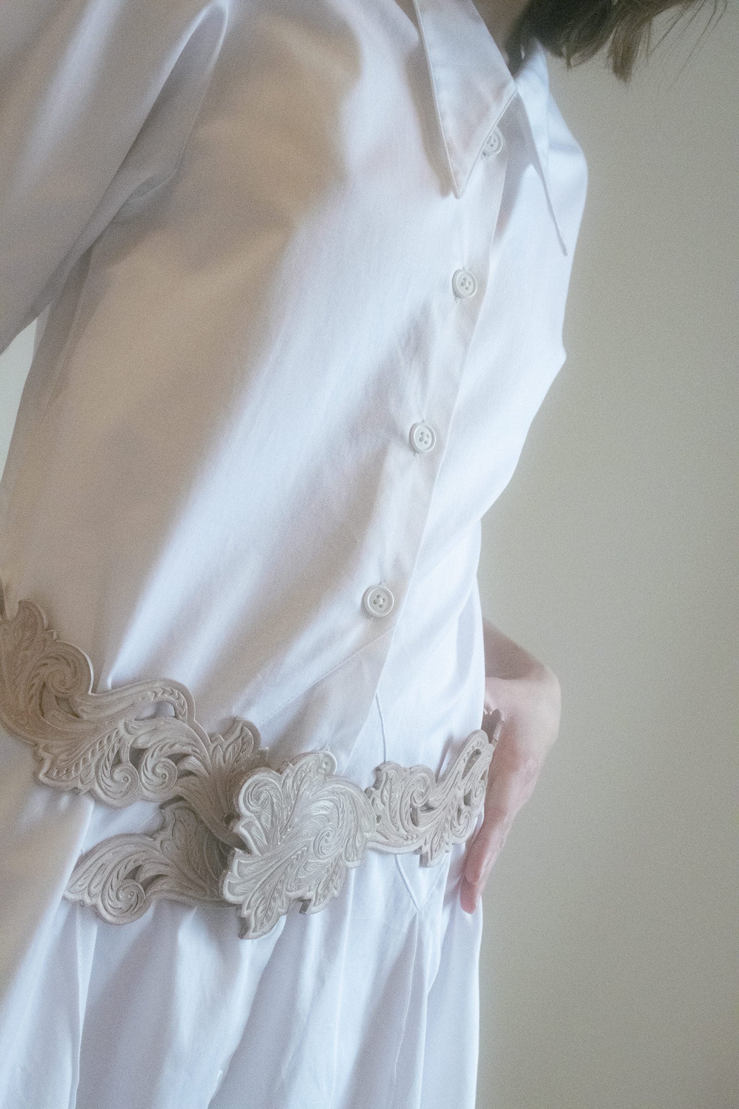 Its short sleeves evoke a sense of ease and timeless style, making it versatile enough for day or night.