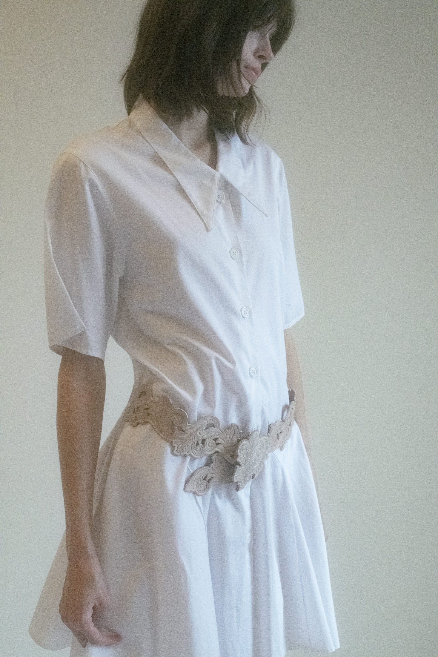 The pointed collar gives a nod to timeless elegance, while the pleated skirt detail adds a dynamic flow that moves with you.