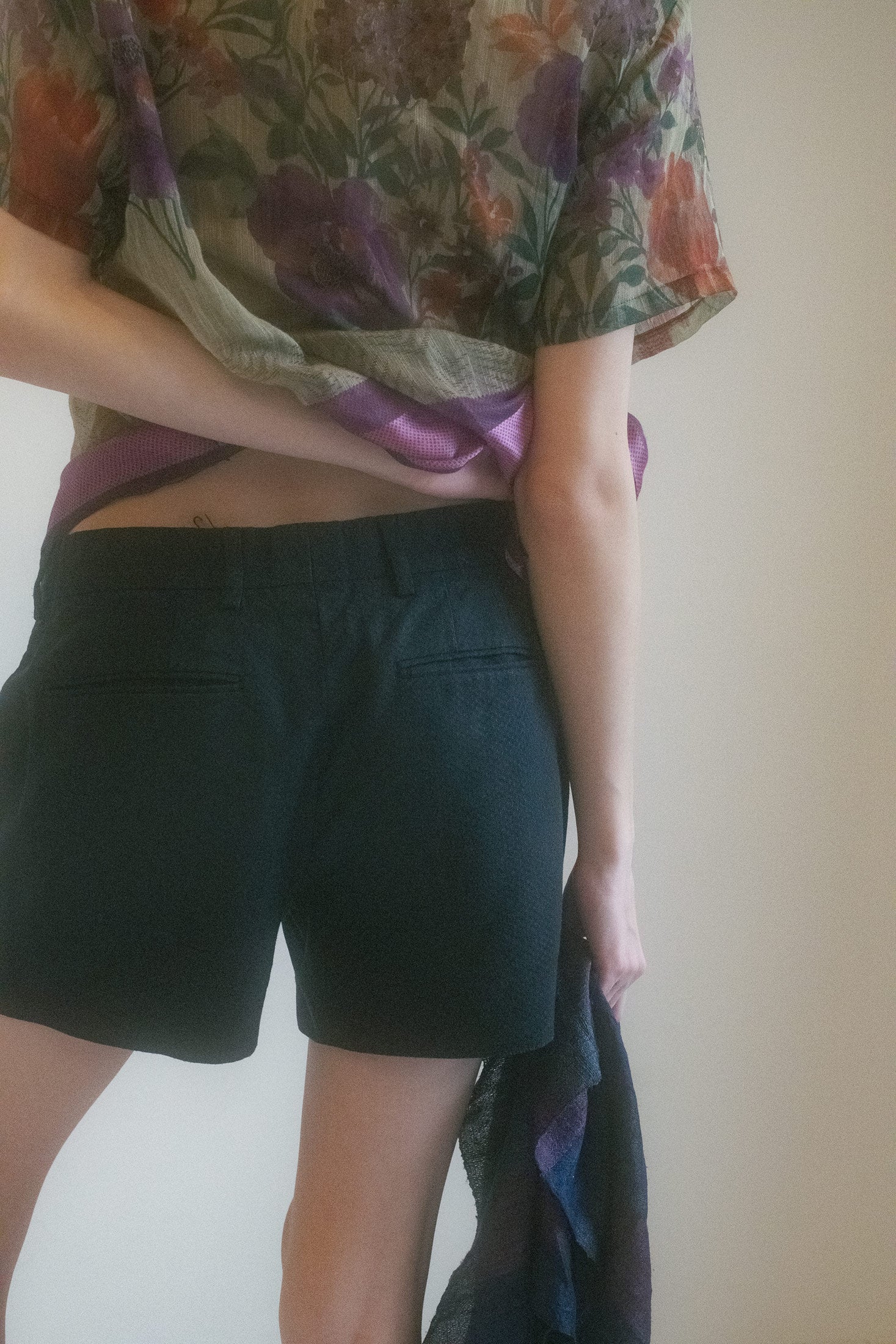 Pocket details nod to function, but their placement feels like choreography.