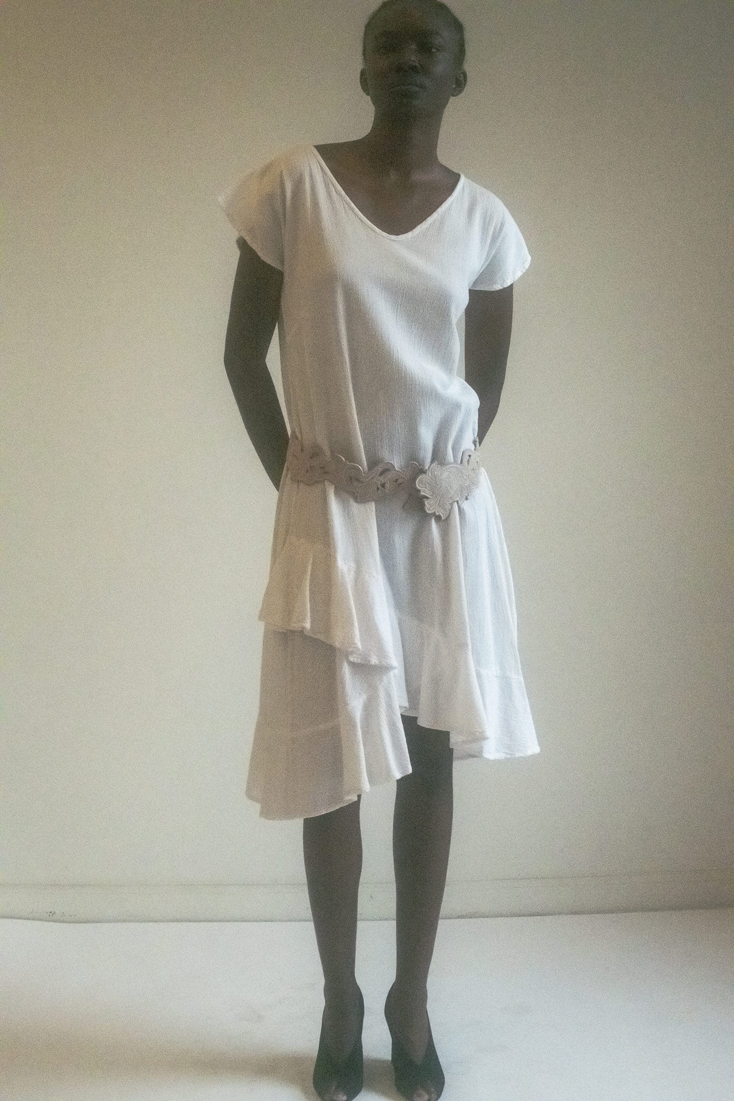 The Ruffle Hem Dress is a celebration of timeless elegance with a modern, dynamic twist.