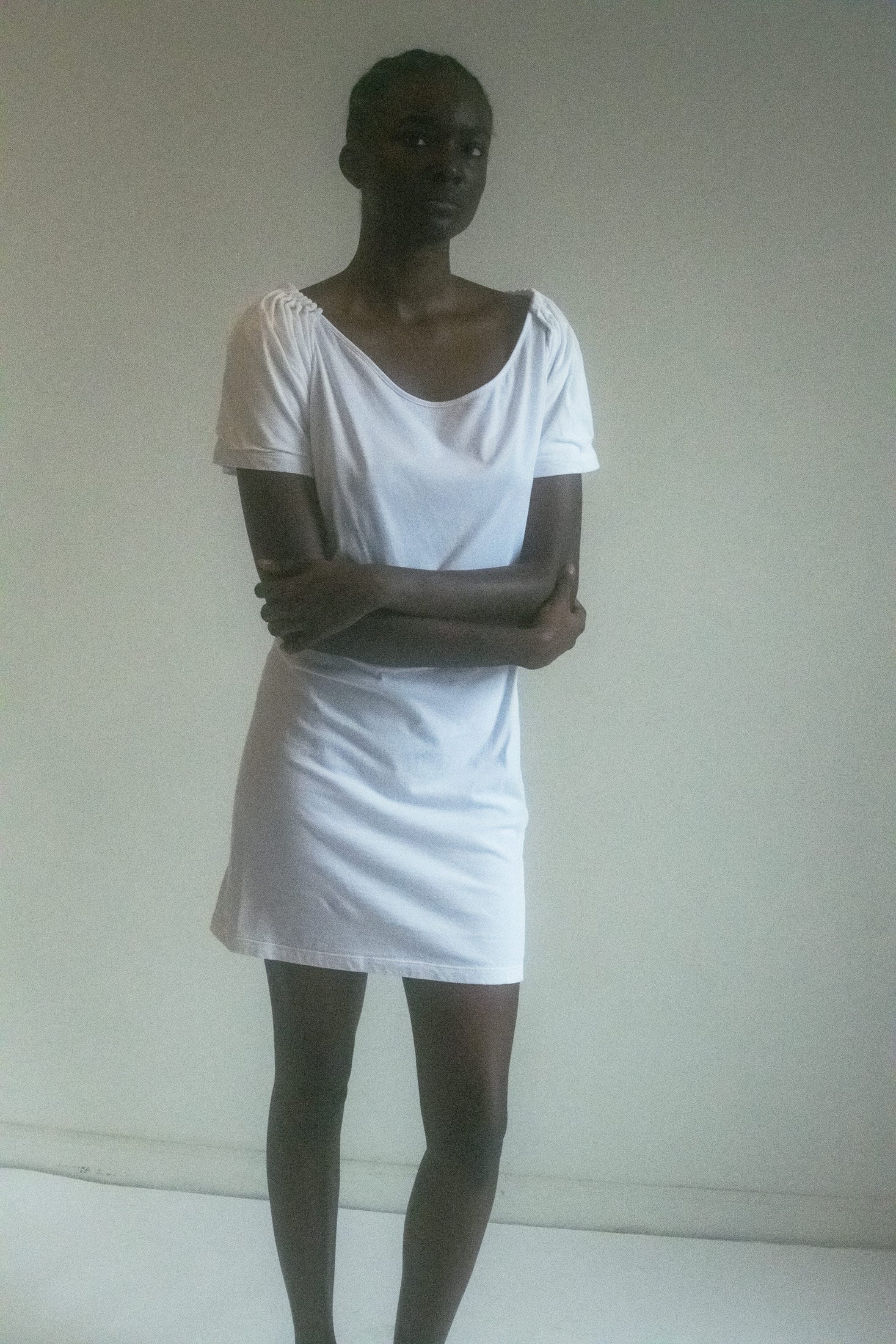 The Hussein Chalayan Mini Dress—a vision in white cotton, yet so much more than that. A piece that plays with shape and silhouette, where softness meets edge, and where every step you take feels like a scene in the making.