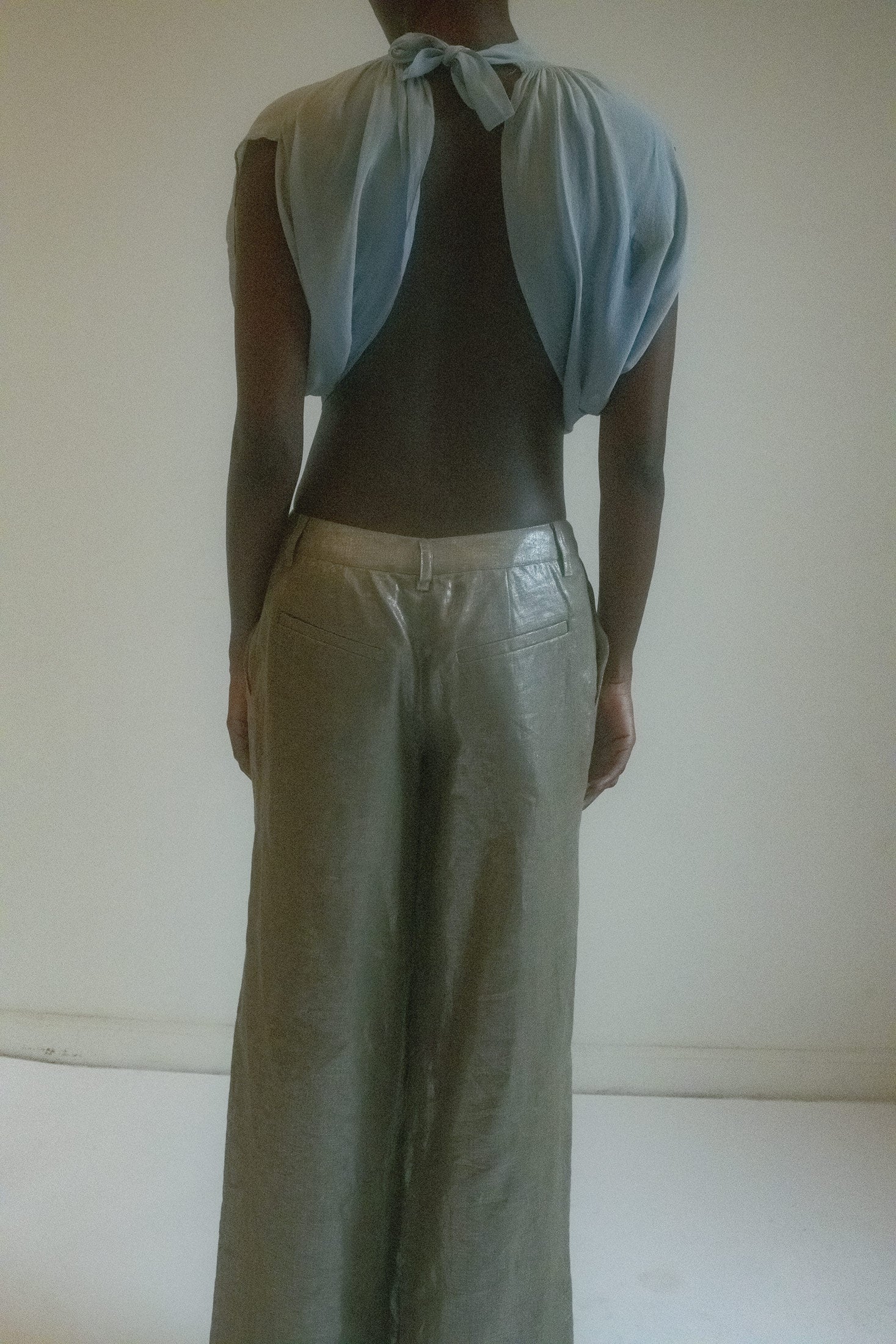 With short sleeves and a fluid, airy quality, this bolero evokes a sense of mystery and dynamic beauty.
