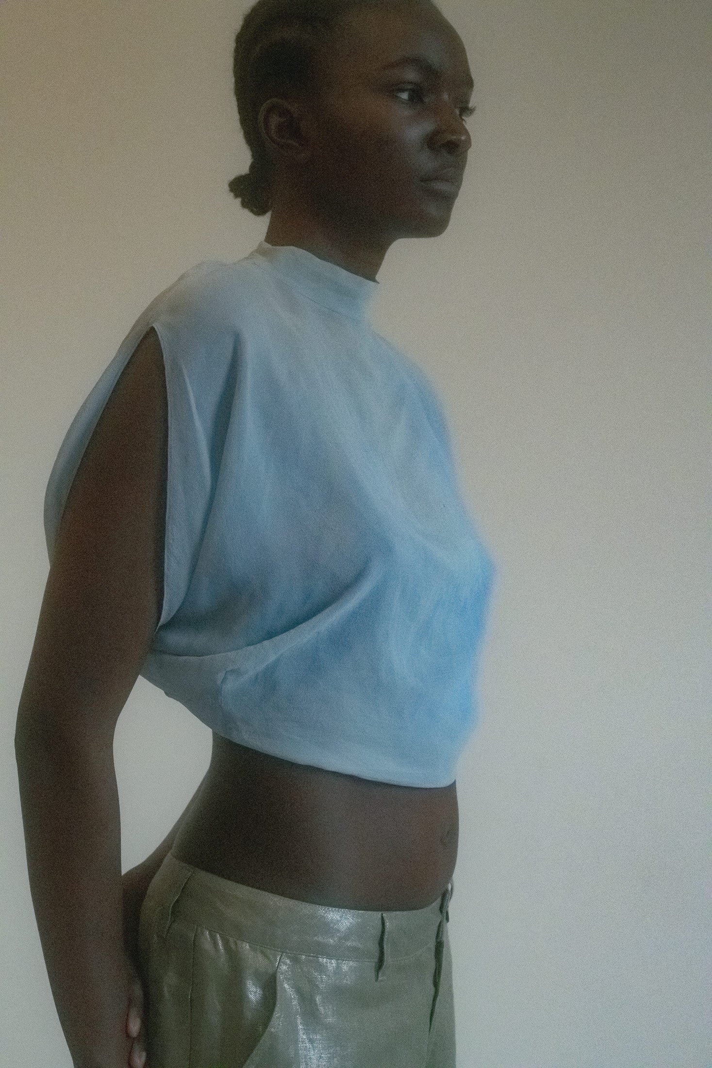 Crafted from a lightweight, sheer fabric, it drapes delicately over the shoulders, creating an ethereal, flowy silhouette that catches the light with every movement.