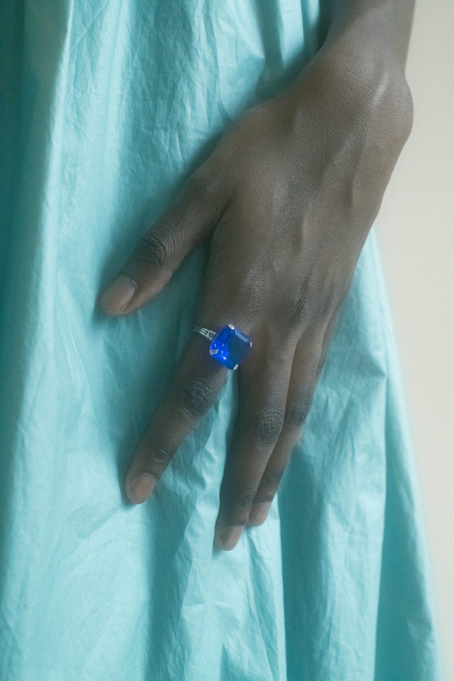 A fever dream in sterling—the Mondo Mondo ring clutches its custom, hand-cut glass stone like a secret.