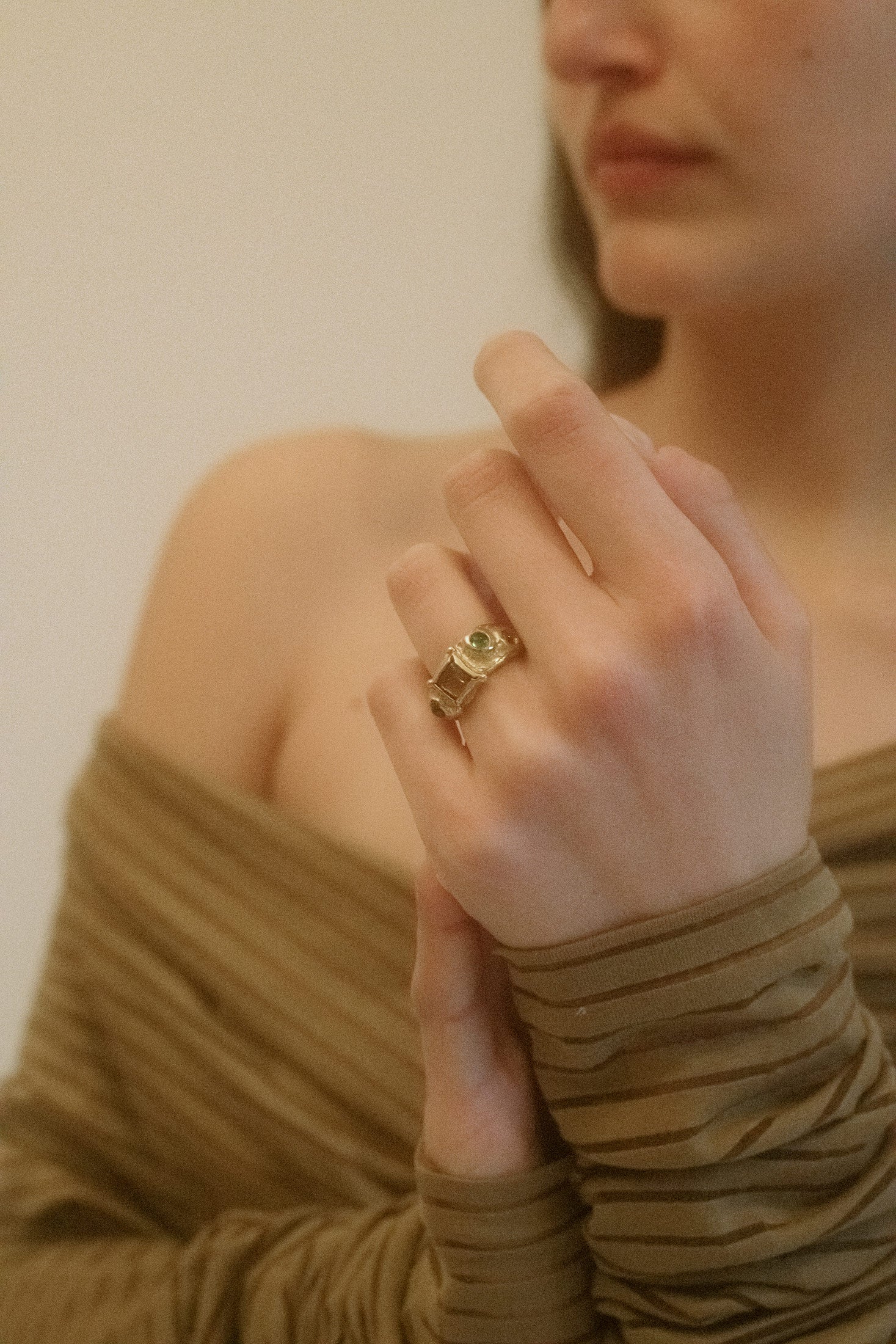 A piece that dances between art and adornment, this sculptural ring from Mondo Mondo is a masterclass in design. Crafted in gold-tone brass, its textured detailing creates an organic flow that mimics the beauty of nature’s most intricate forms.