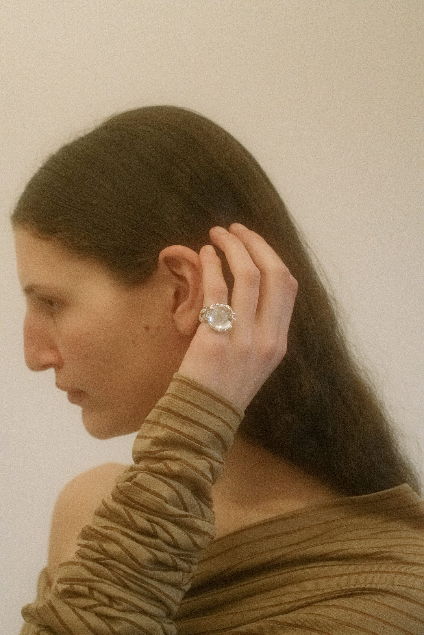At its heart, a crystal glass stone glows with mythic intensity—cut to catch light the way a glance catches desire.