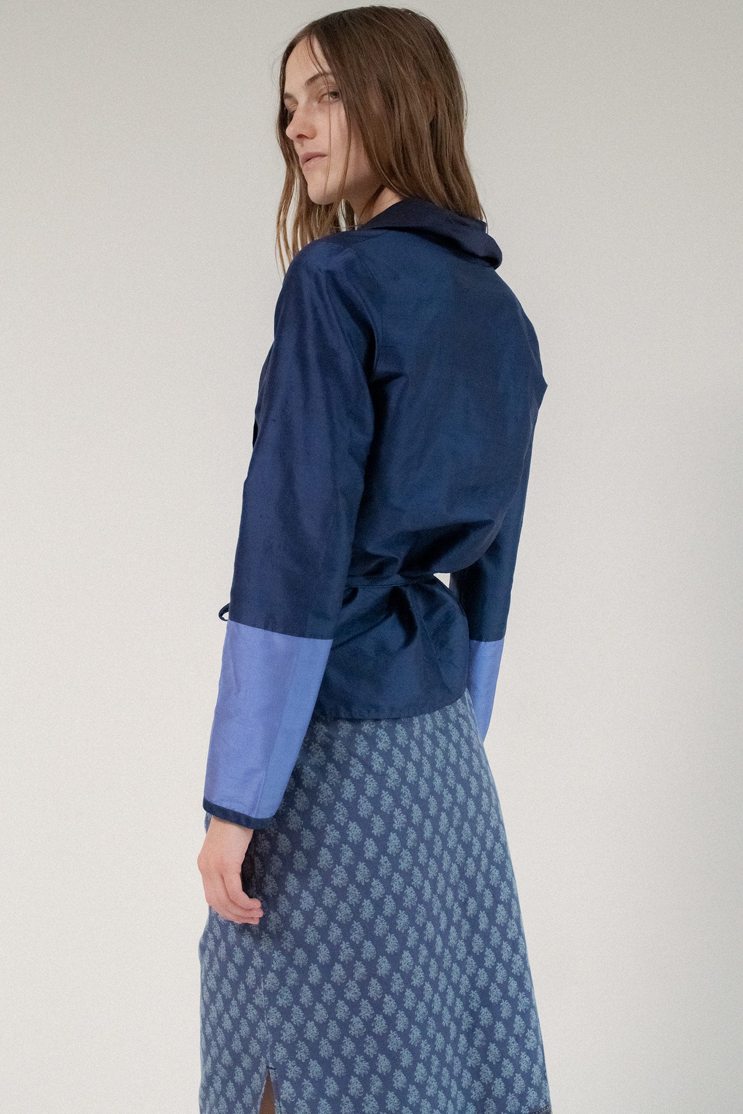 Lightweight and luminous, the iridescent silk catches the light with every movement, revealing layers of color, mood, and mystery.