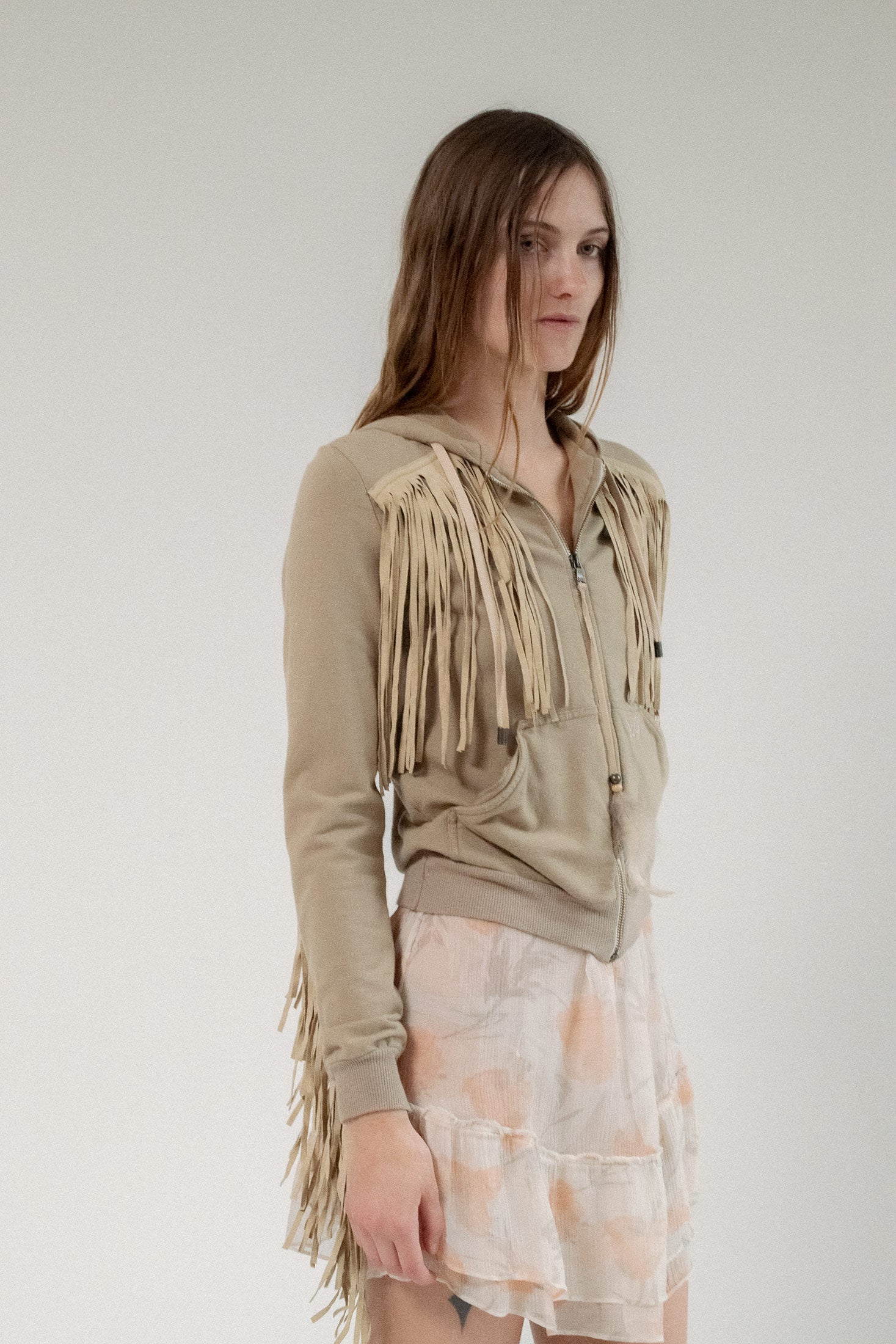Where Western edge meets Italian elegance, the D&G Fringe Sweatshirt redefines the classic with a seductive twist.