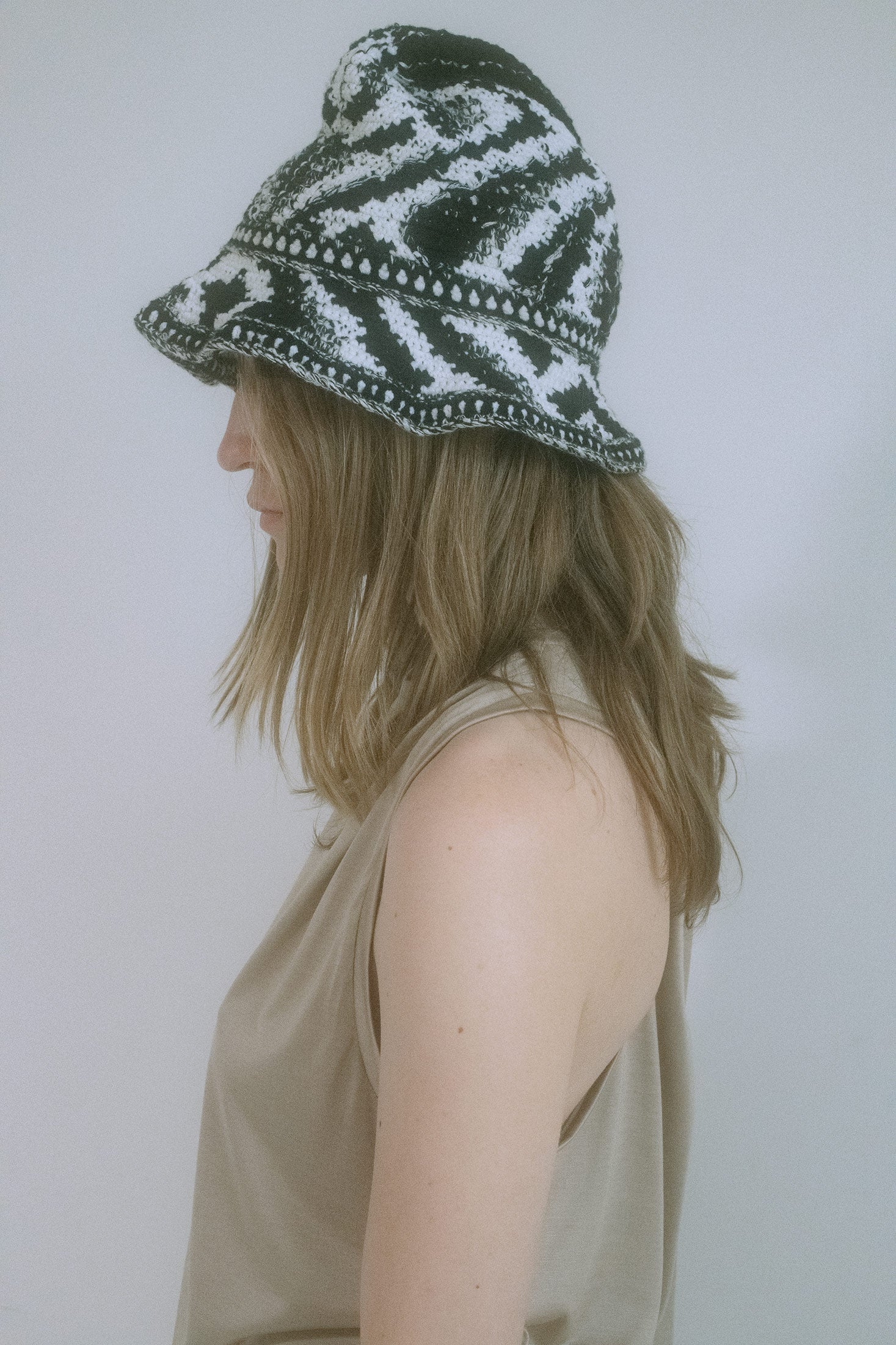 From the hands of Judy Turner comes a knit hat that tilts toward the surreal.