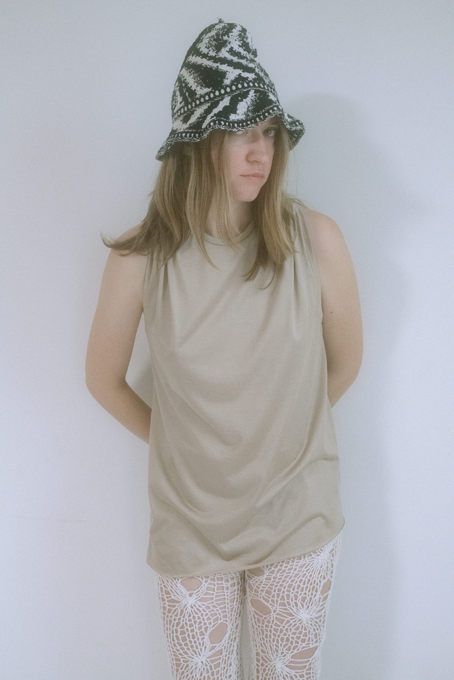 Crafted in New York with a small, sculpted brim and exaggerated volume that peaks into a quiet, fin-like crest.