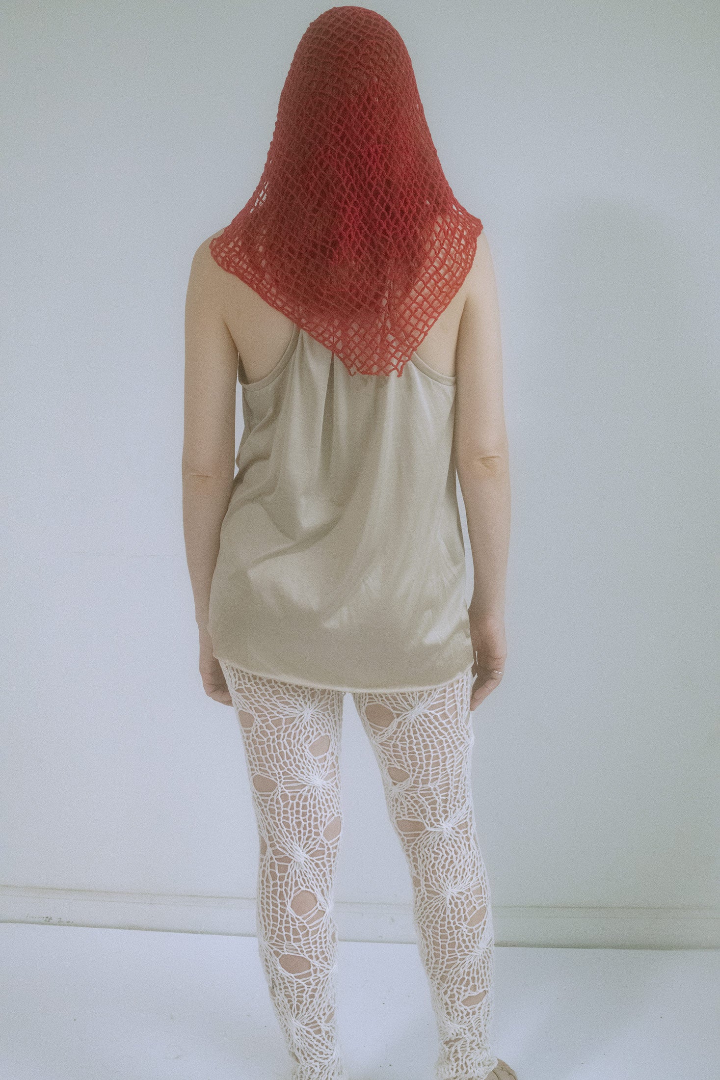 This headpiece blurs the line between accessory and atmosphere.
