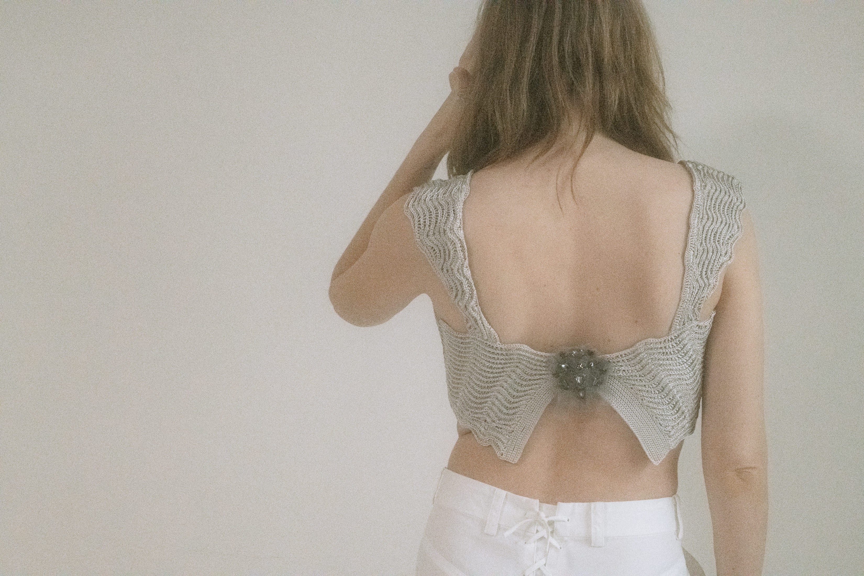 A piece that clings like a secret and flashes like a dare.
