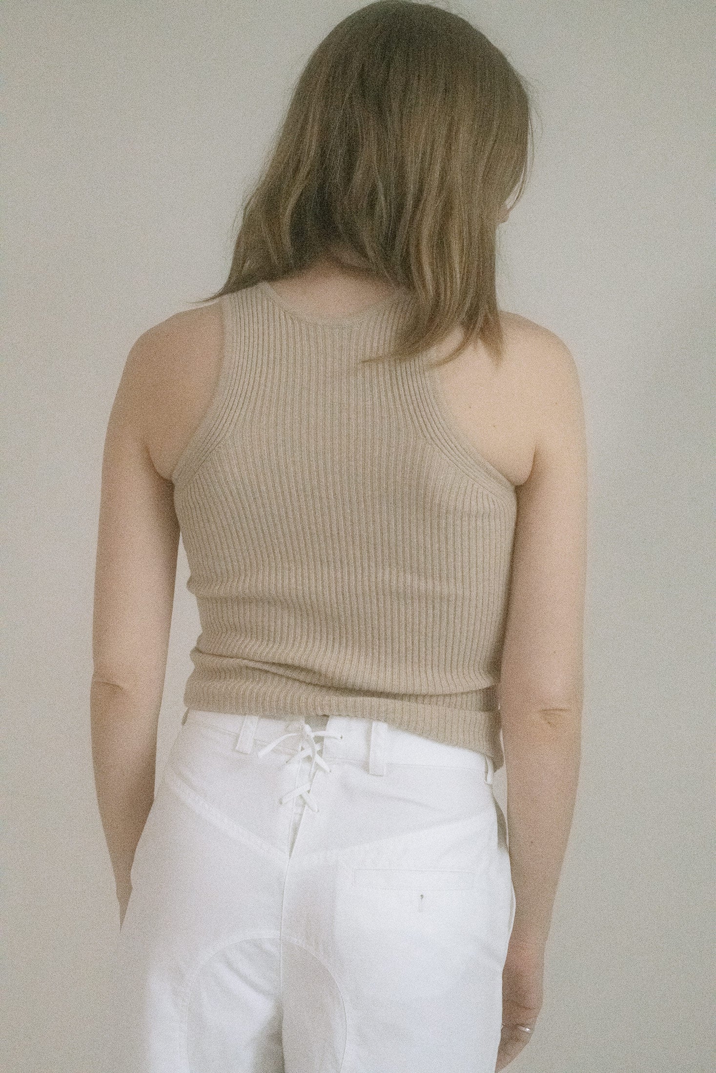 A classic scoop neck skims the collarbone, while the tan ribbed cotton hugs just close enough to imply more.