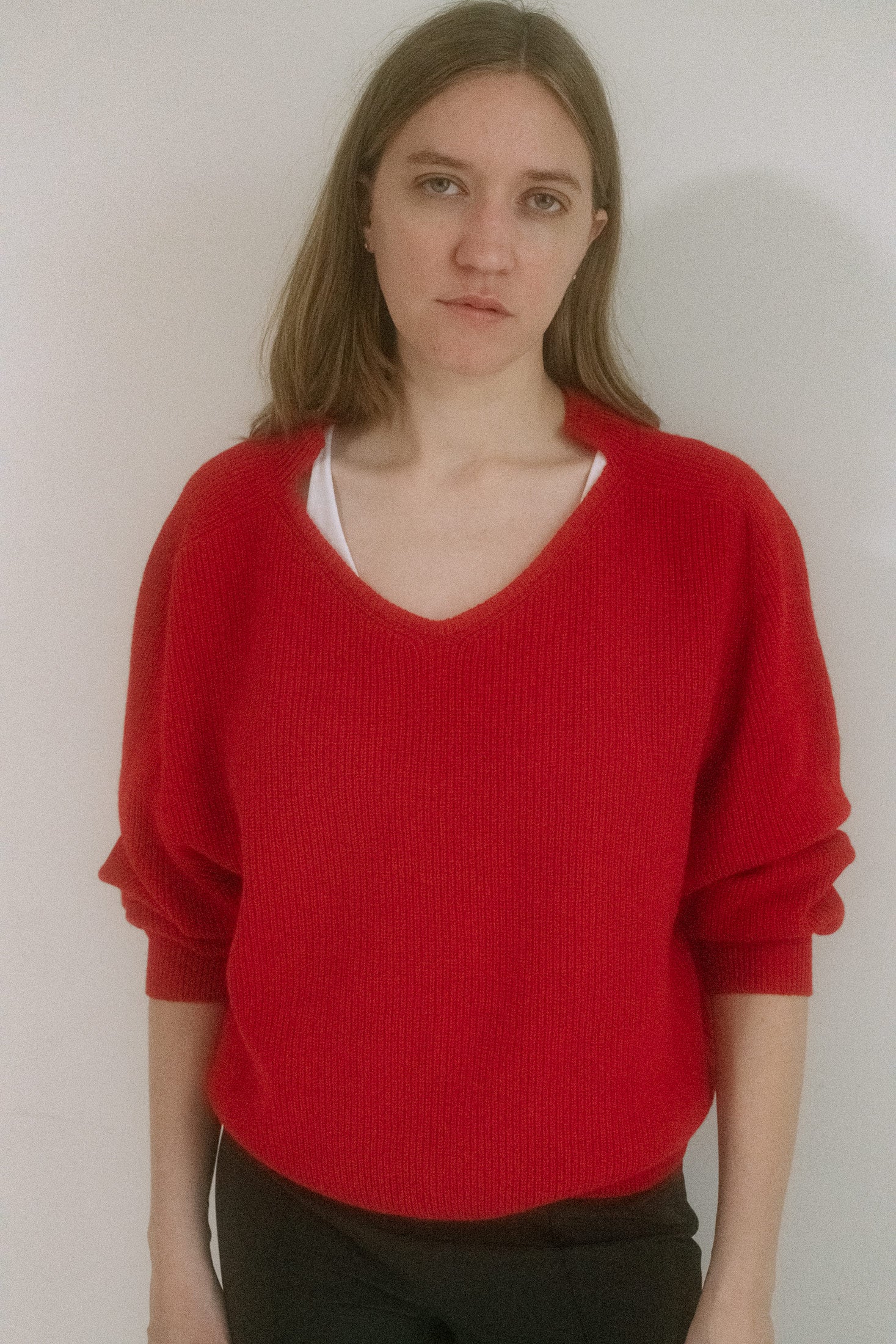 In a ripe cherry red and cut with a scoop neck and subtle collar, it slips on with a relaxed fit.