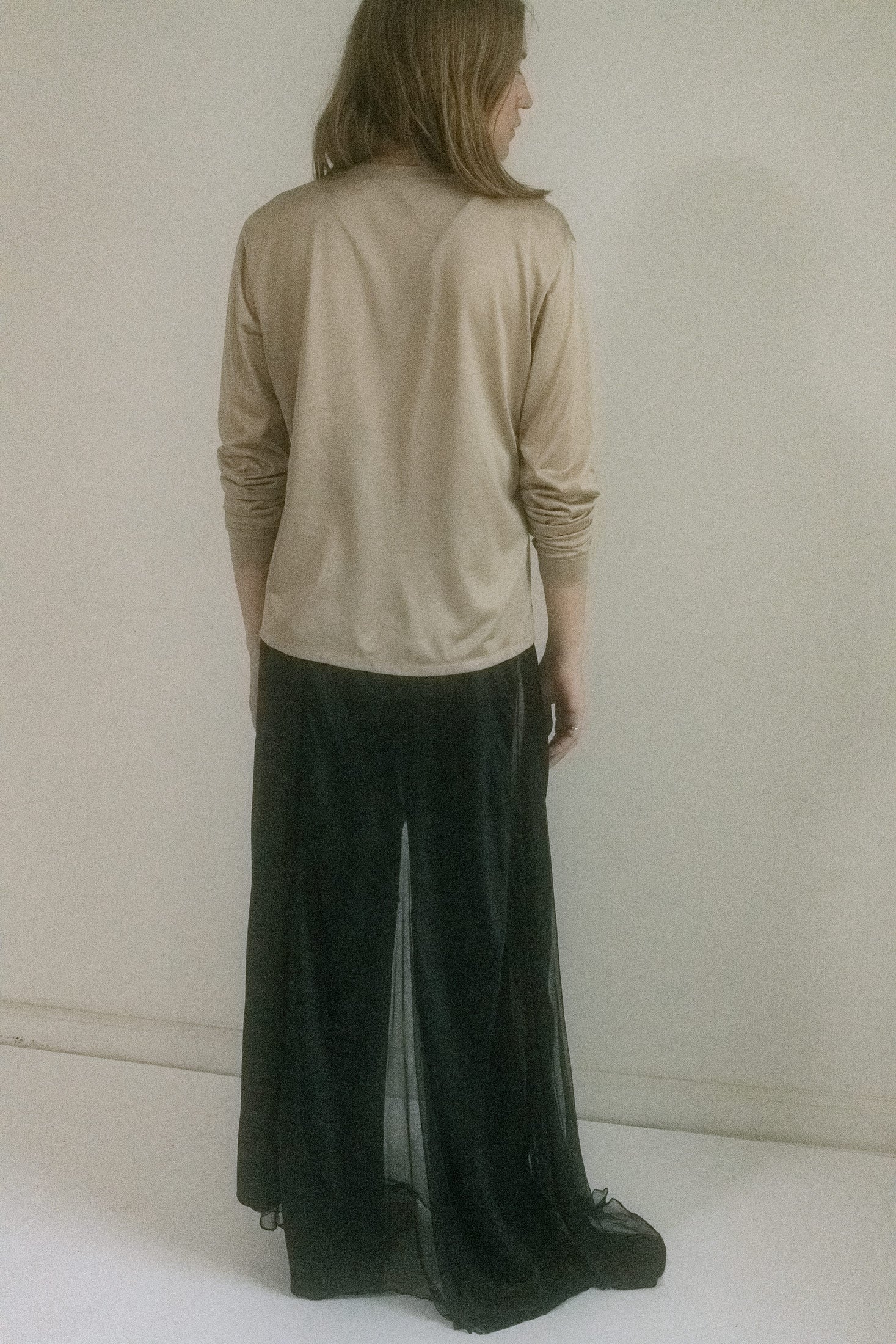 The fit is relaxed, almost too easy, draping with the kind of casual seduction that feels accidental. But nothing here is accidental.