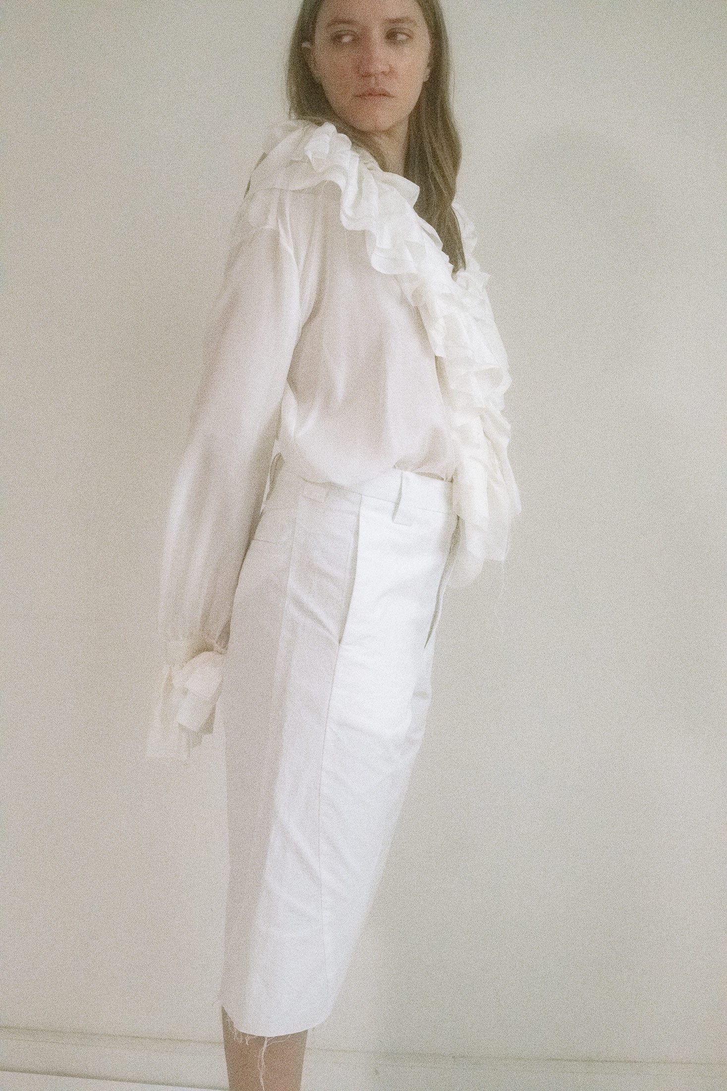 Belt loops circle the waist like silent sentinels, while two side seam pockets blend function with ease.