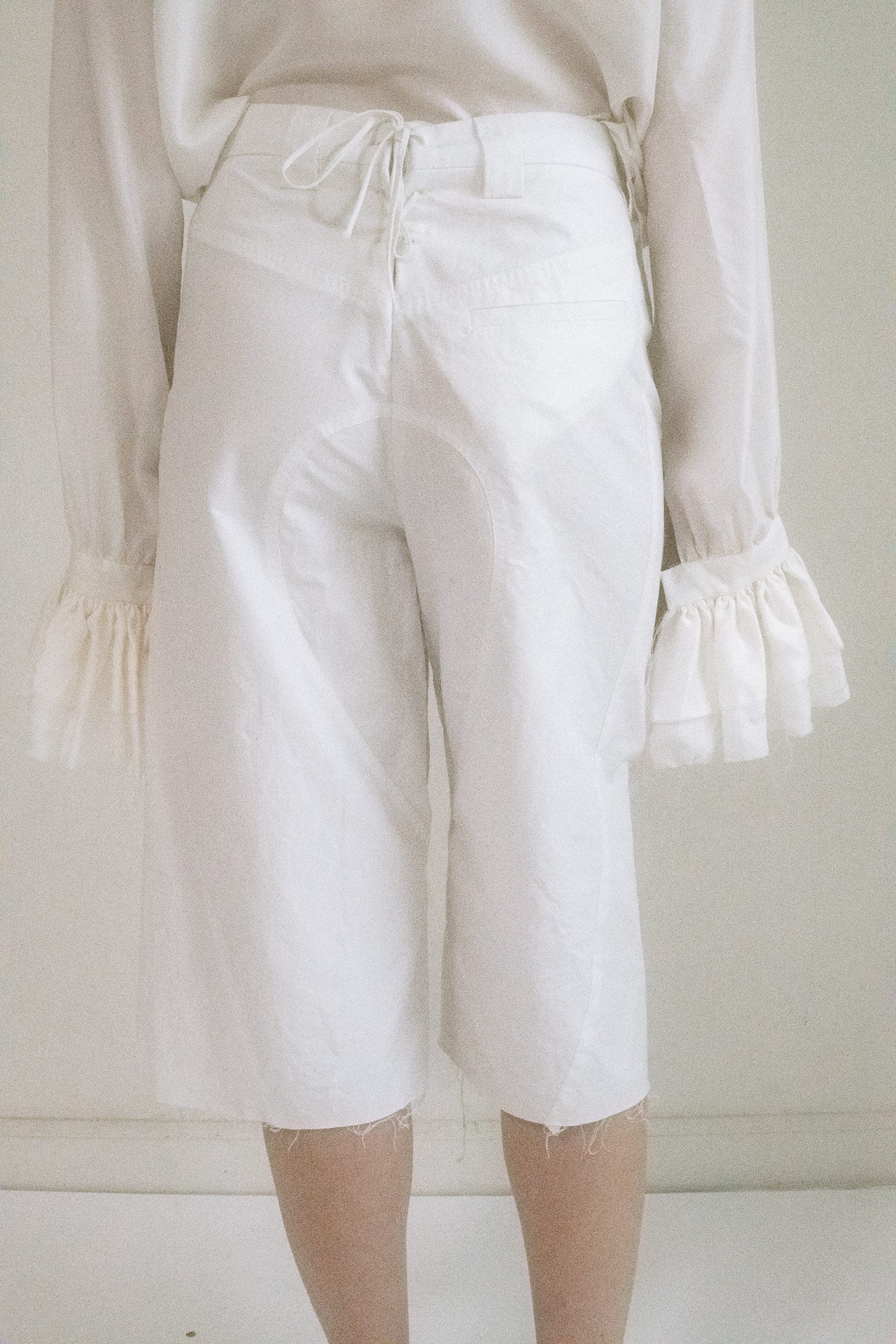 ELONGATED SHORTS