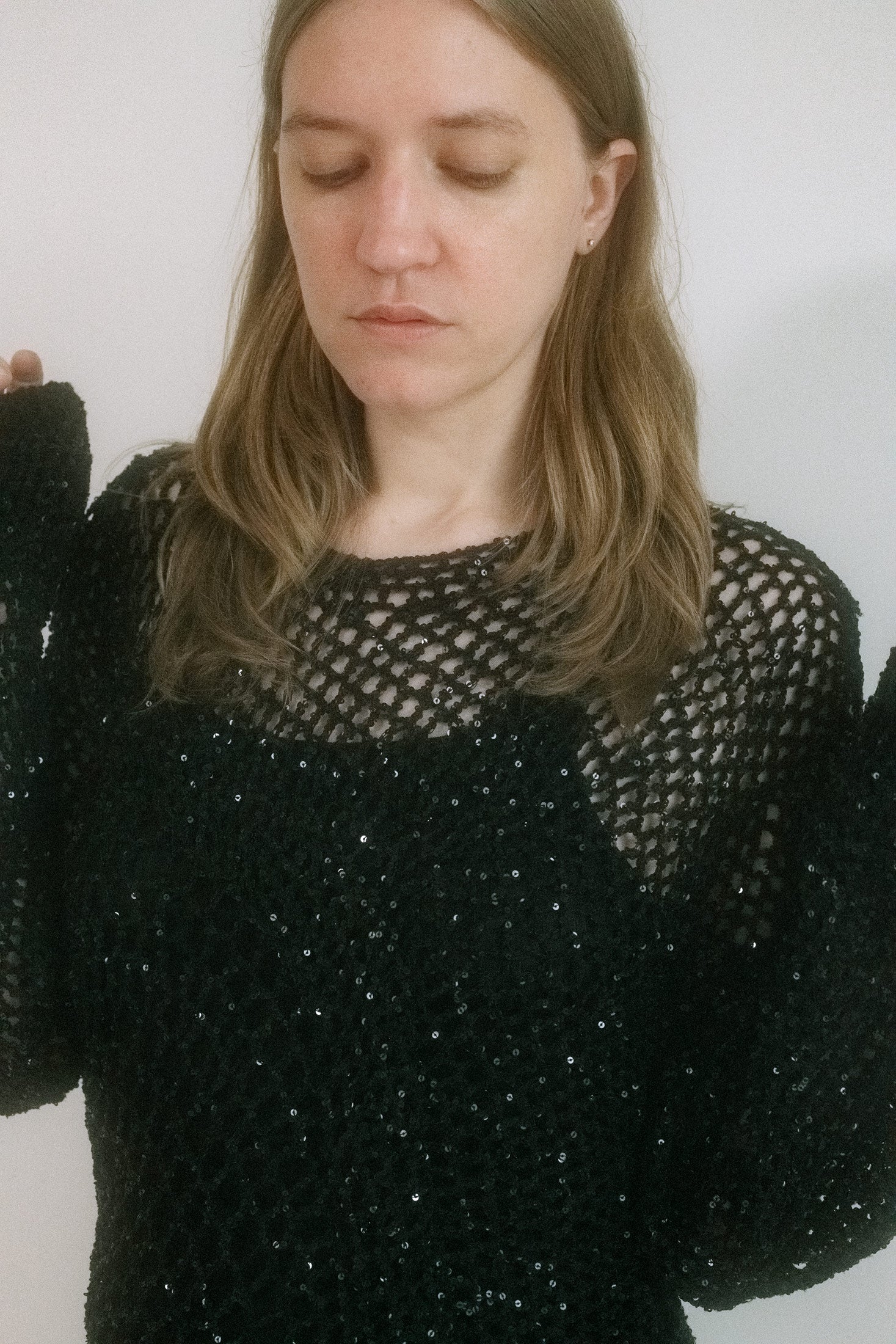 This long sleeve crochet sweater from Judy Turner, made in New York, clings to the body with a spiderweb’s patience.