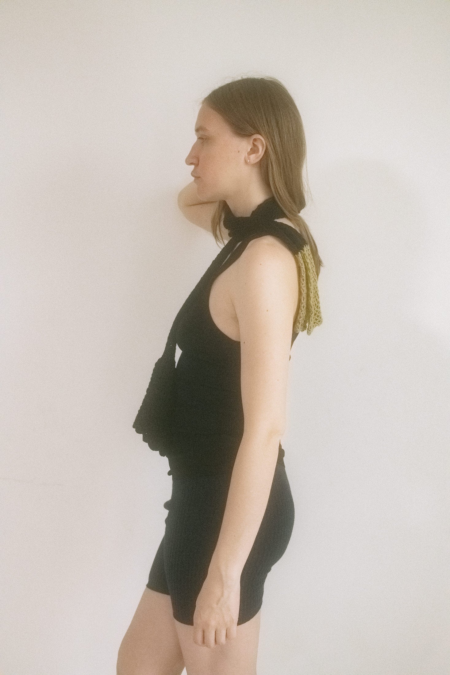 Black meets gold in bold color blocking, while bell flower details flirt at each end like whispered promises.