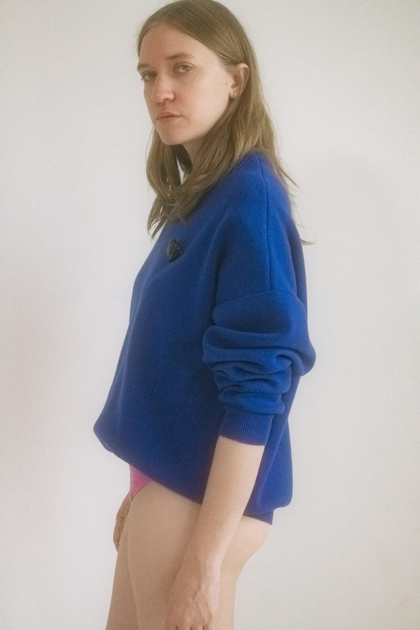 From Judy Turner’s downtown atelier: a cobalt blue crew neck sweater that doesn’t just walk into a room, it prowls.