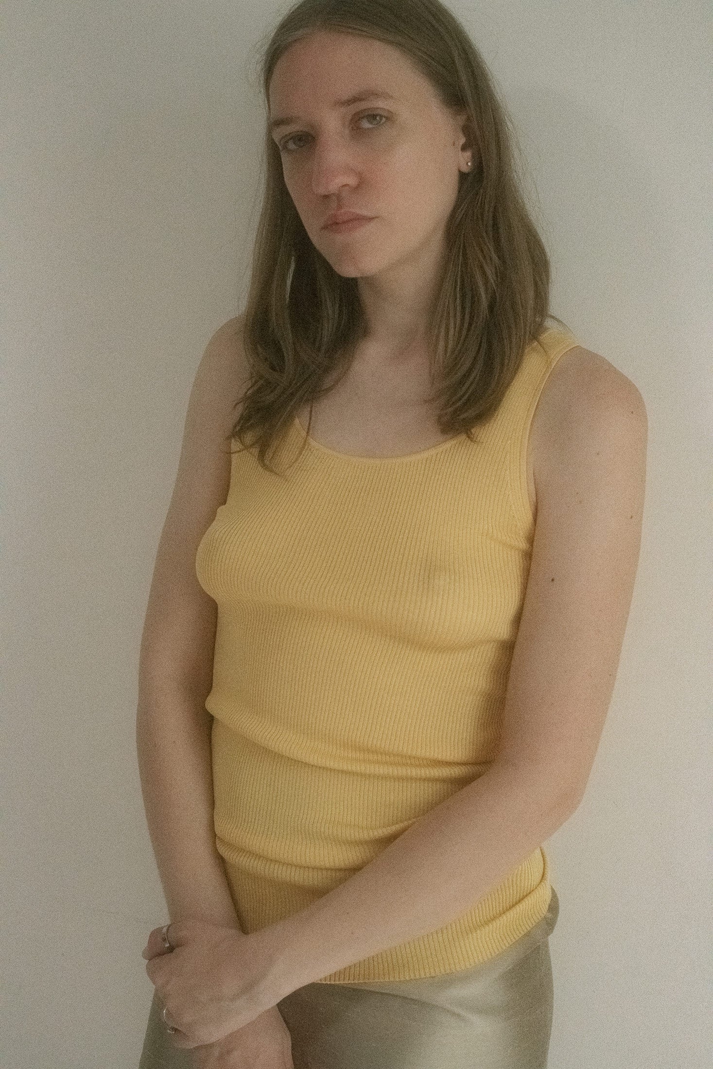 A classic scoop neck skims the collarbone, while the mango hued ribbed cotton hugs just close enough to imply more.
