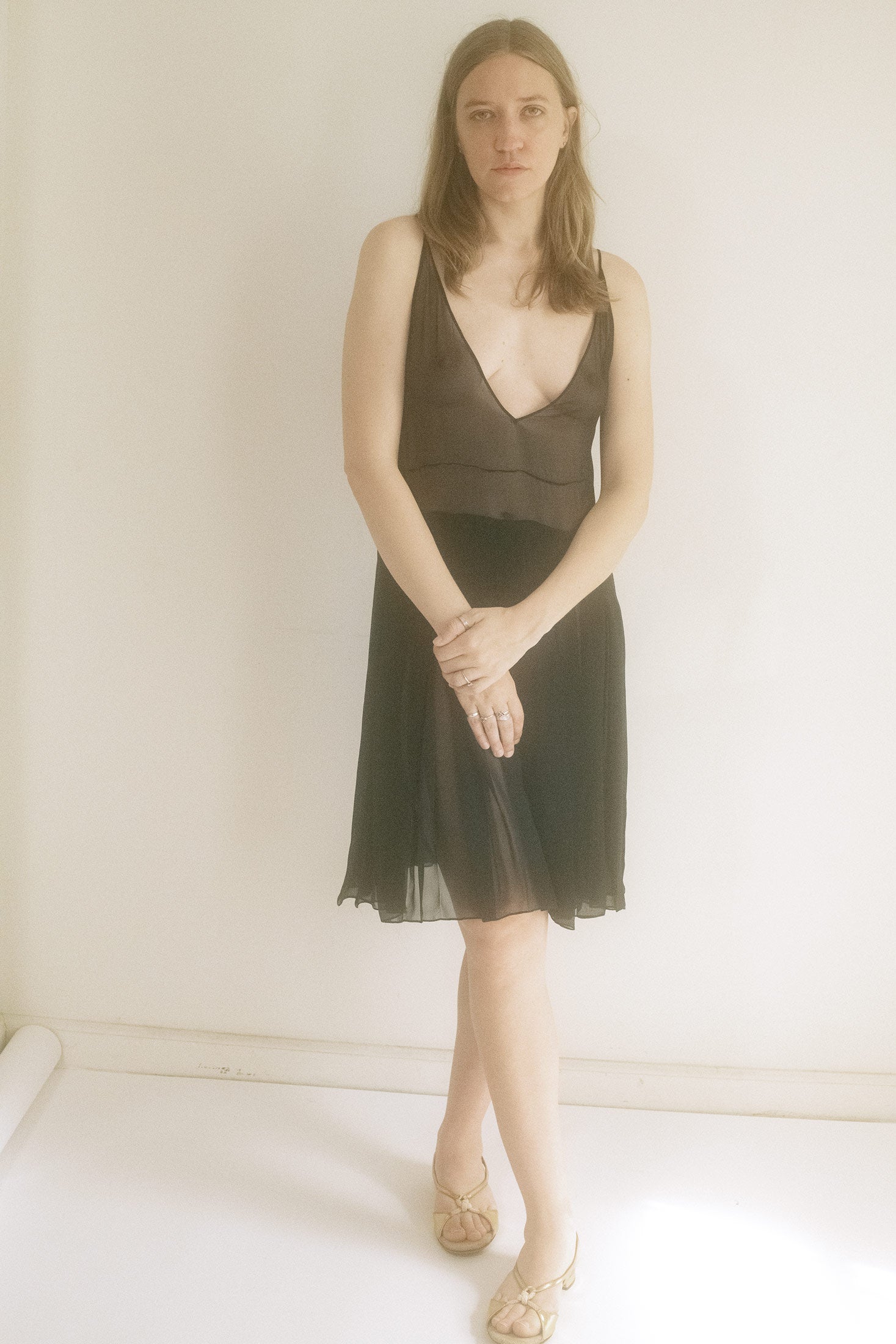 From Judy Turner’s New York atelier, this mini dress is a midnight secret spun from silk chiffon.