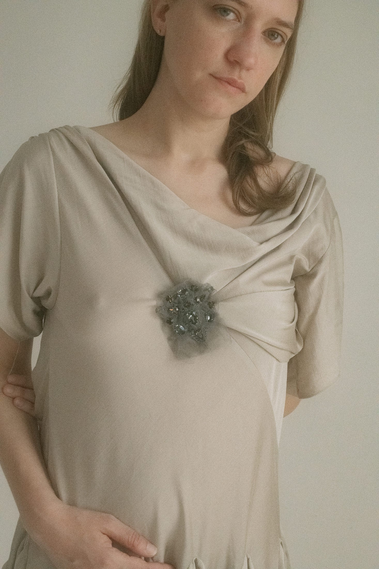 Cap sleeves flirt at the edge of the shoulder, while a low back slips out the exit without saying goodbye.