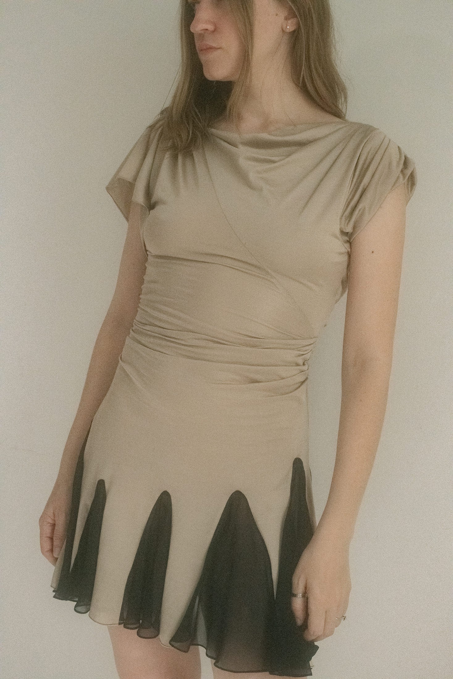 Made in New York, this two-tone mini slips between knit jersey and silk chiffon like it’s changing identities mid-scene.