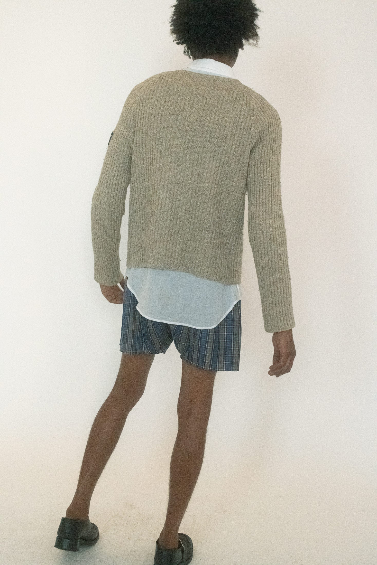 It’s oatmeal in tone, ribbed in texture and unassuming until you notice the way it hangs on the body just so.