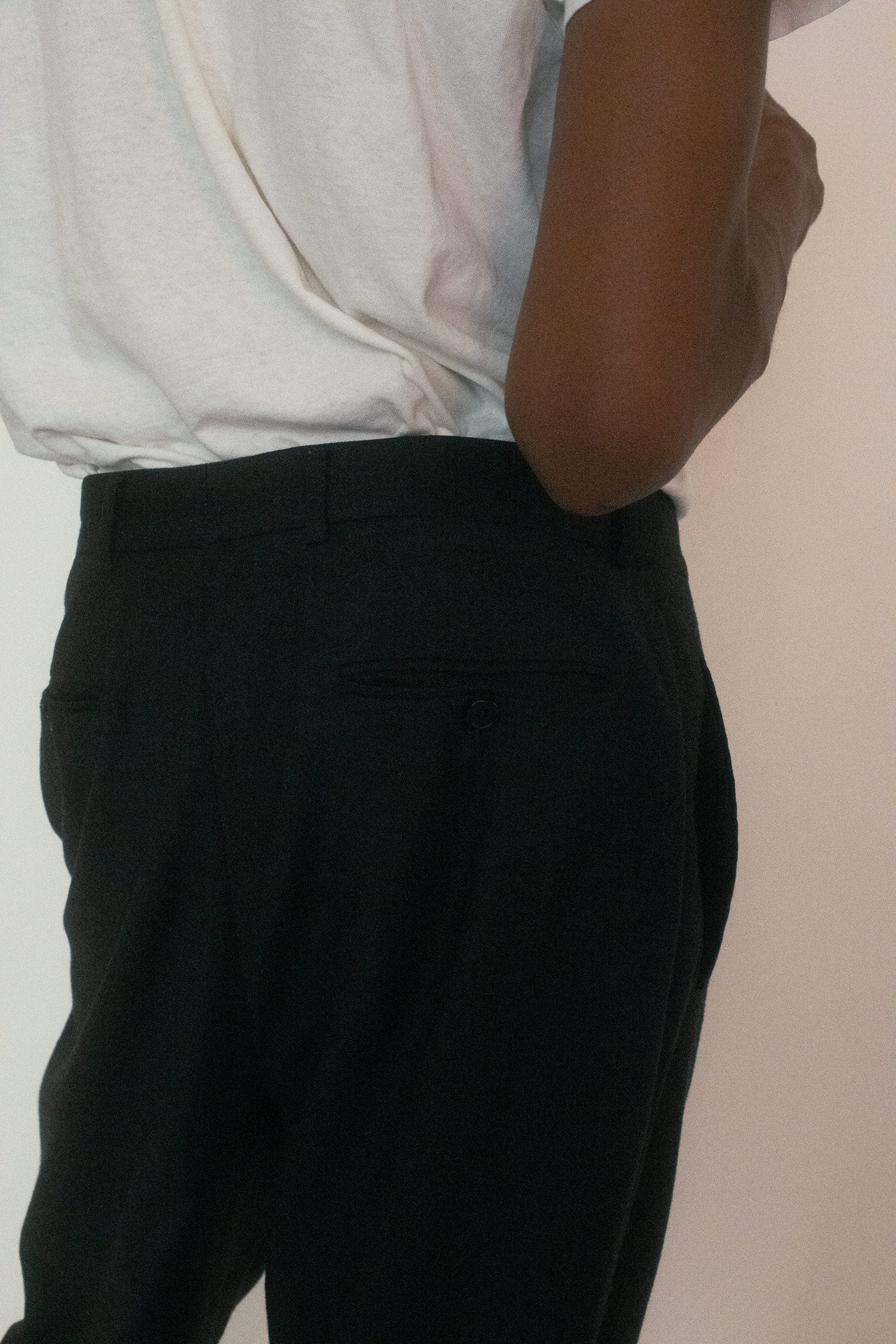 In black, they become a blank stage where body and posture do the speaking.