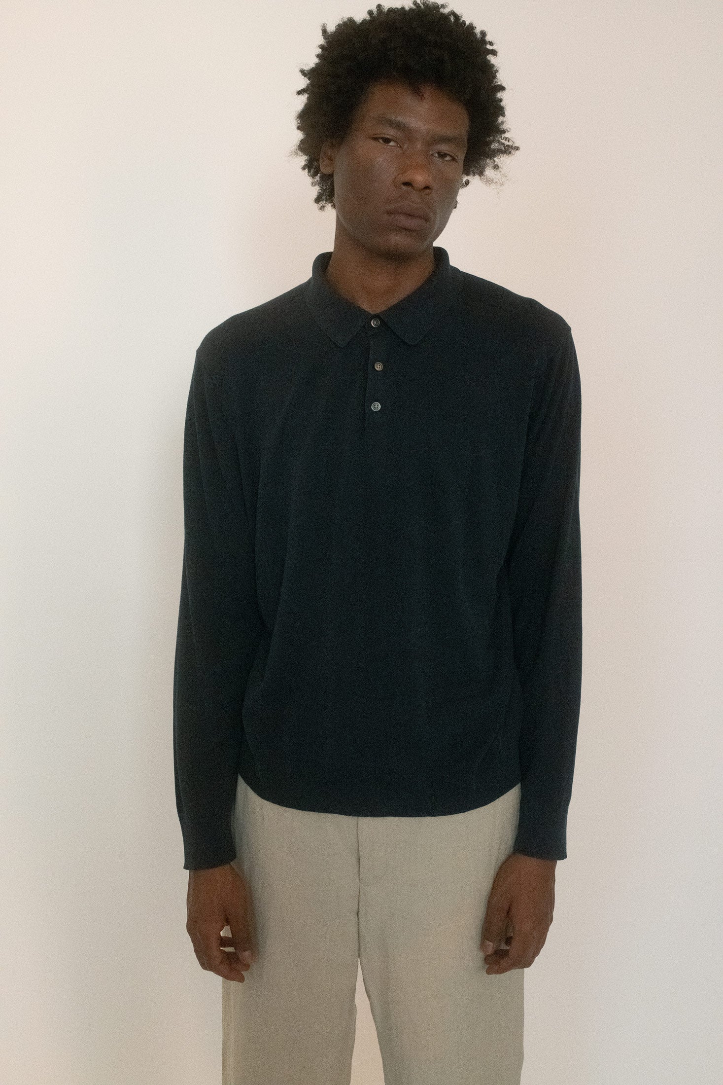 From The Society Archive, a polo with quiet gravity, softened by time.