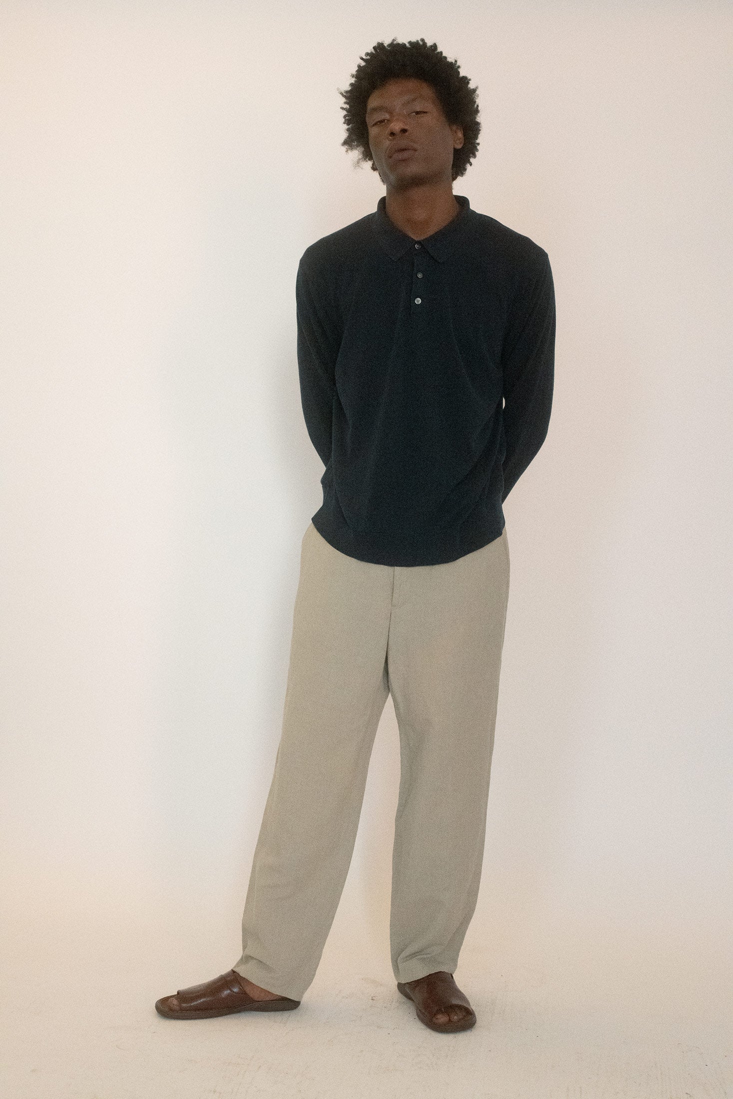 A true vintage Brooks Brothers knit, it’s cut in navy with a 3-button closure and a collared neckline that frames the face in clean lines.