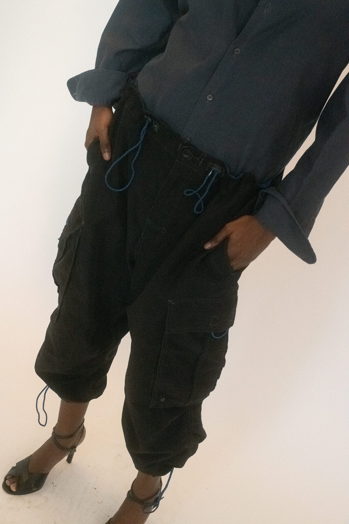 Side pockets amplify the utilitarian slant, but the elasticated waist and cinched hems at each leg turn them sporty.