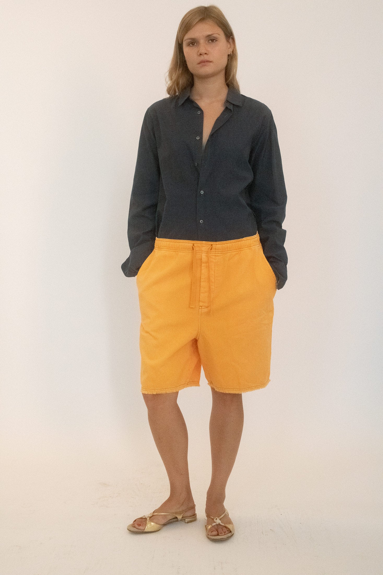 The elasticated waistband with drawstring pulls them into ease, while the pocket details nod to practical instincts.