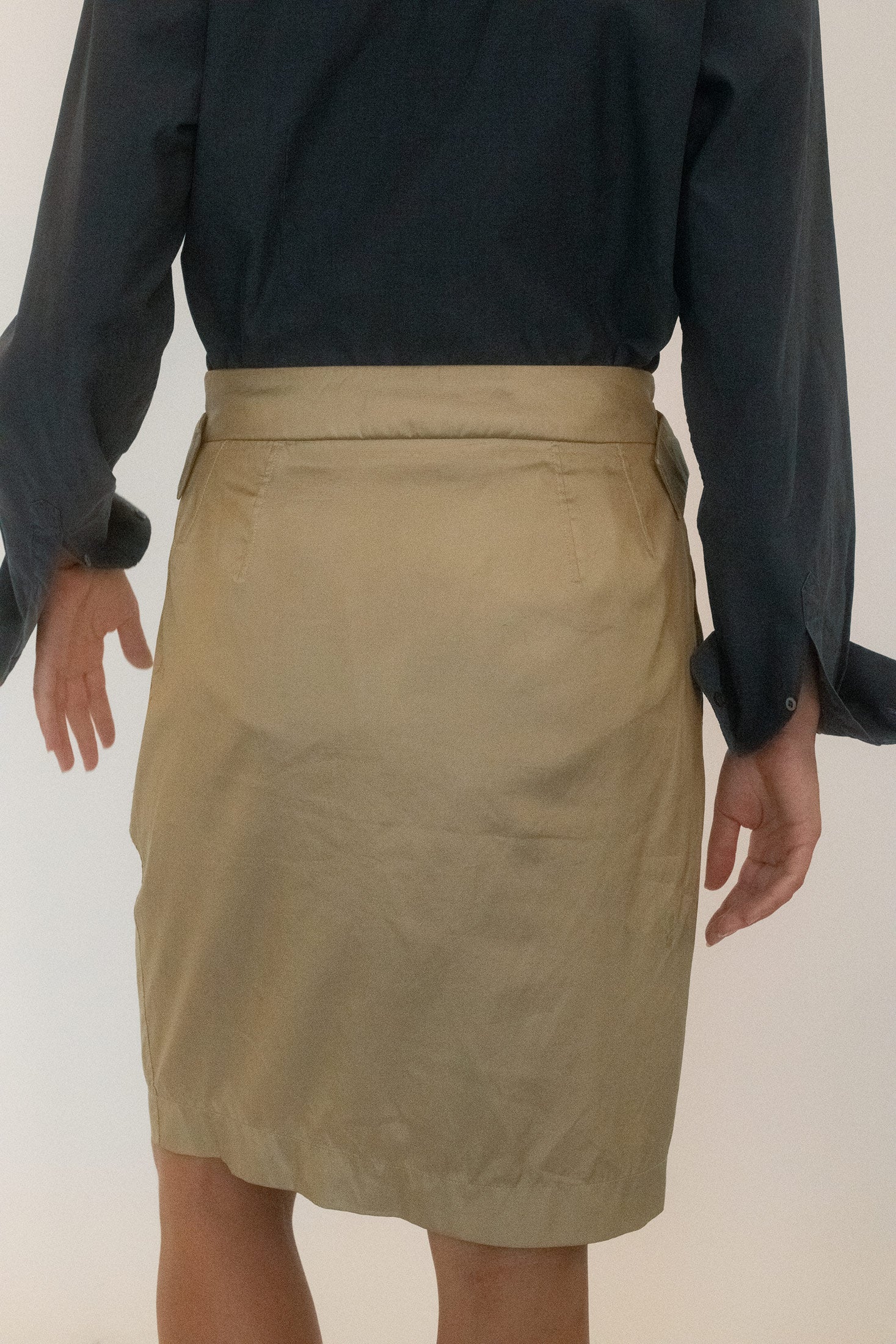 Cut to a pencil silhouette, streamlined, exact, yet edged with seduction.