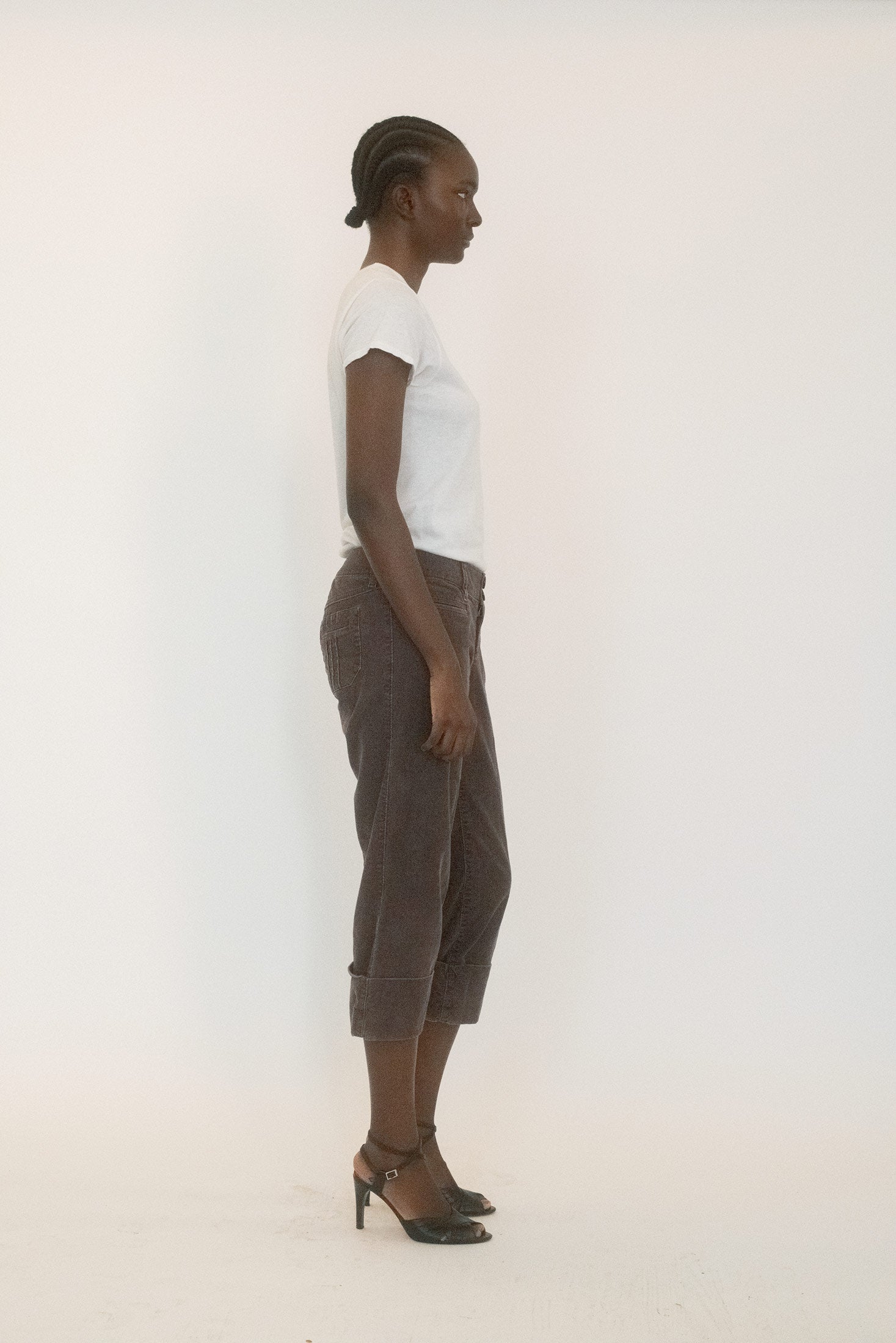Slit pockets at the front, belt loops cinching the possibility of polish, every element speaks of formality undone.