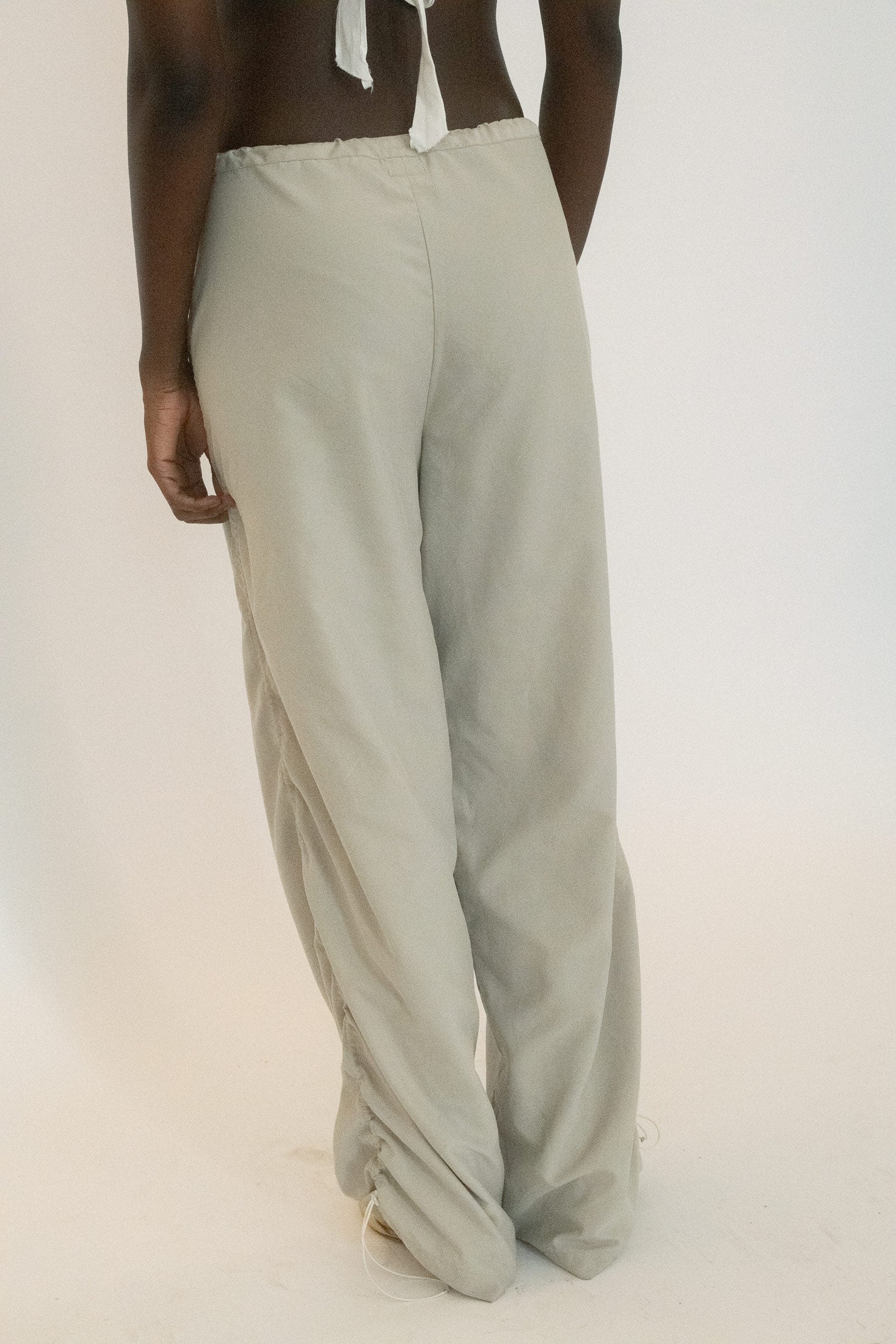 They’re pants made for a chase scene or a late night rehearsal, equal parts utilitarian and suggestive.
Sourced from The Society Archive.