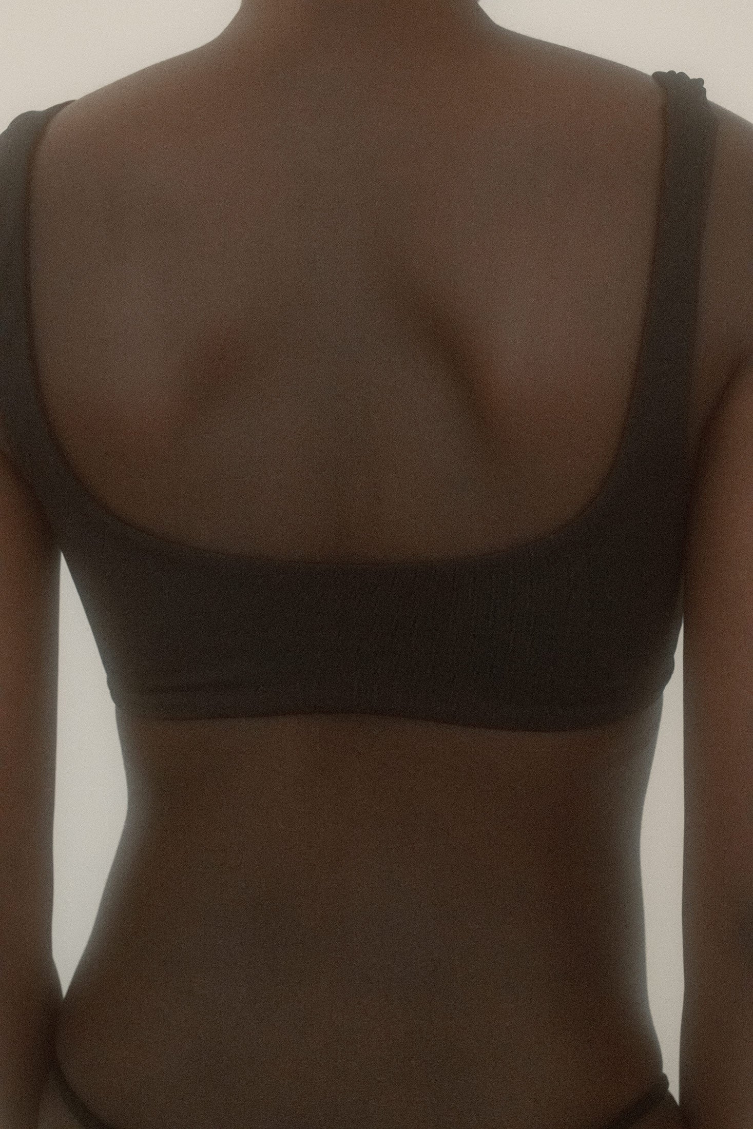 Ruched at the bust with thick straps, a pull on silhouette that doesn’t ask permission.